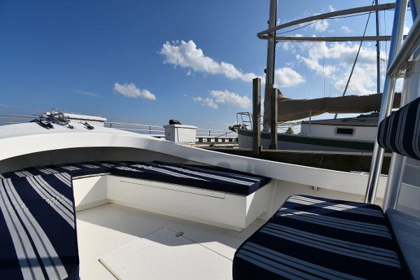 2021 Eastern 248 Center Console boat with striped seating at a marina.