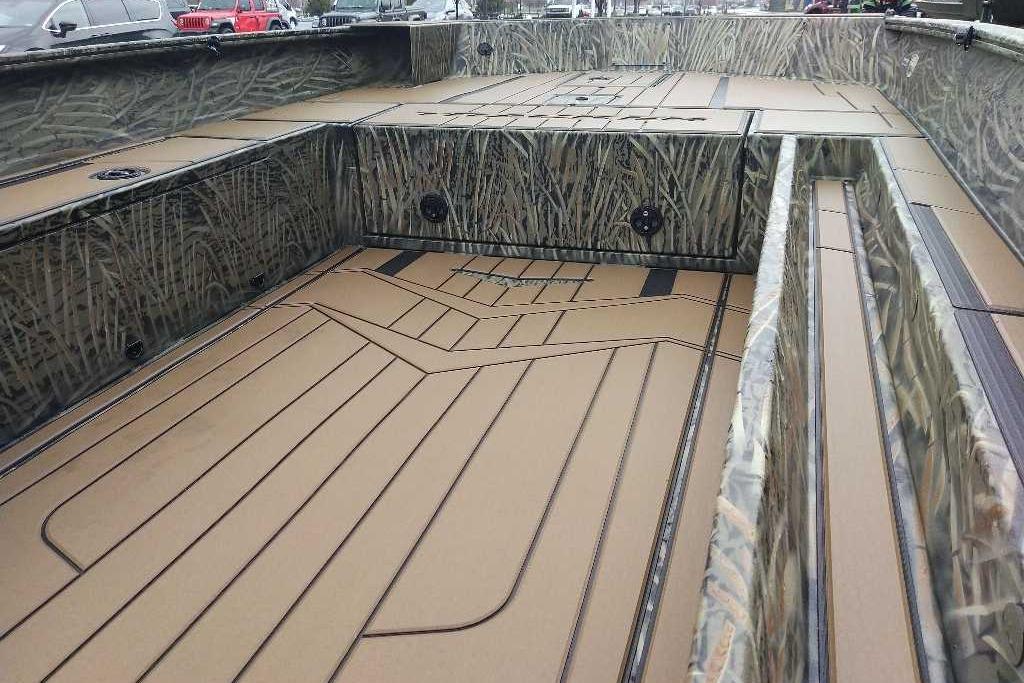 2026 Tracker Grizzly 1756 T Marsh boat interior with camo design and spacious deck.