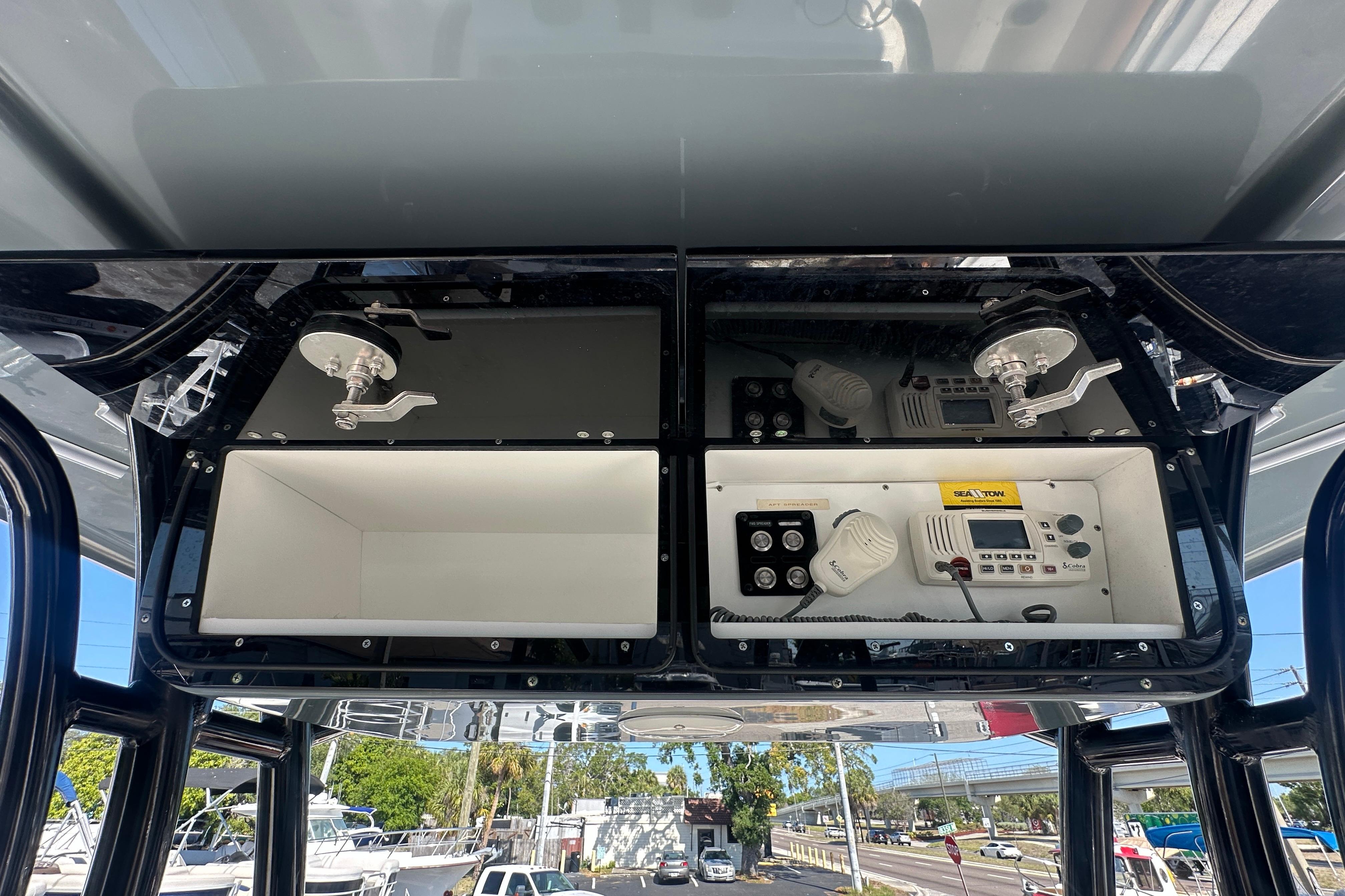 2021 Key West 263 FS boat console with storage and electronic controls.