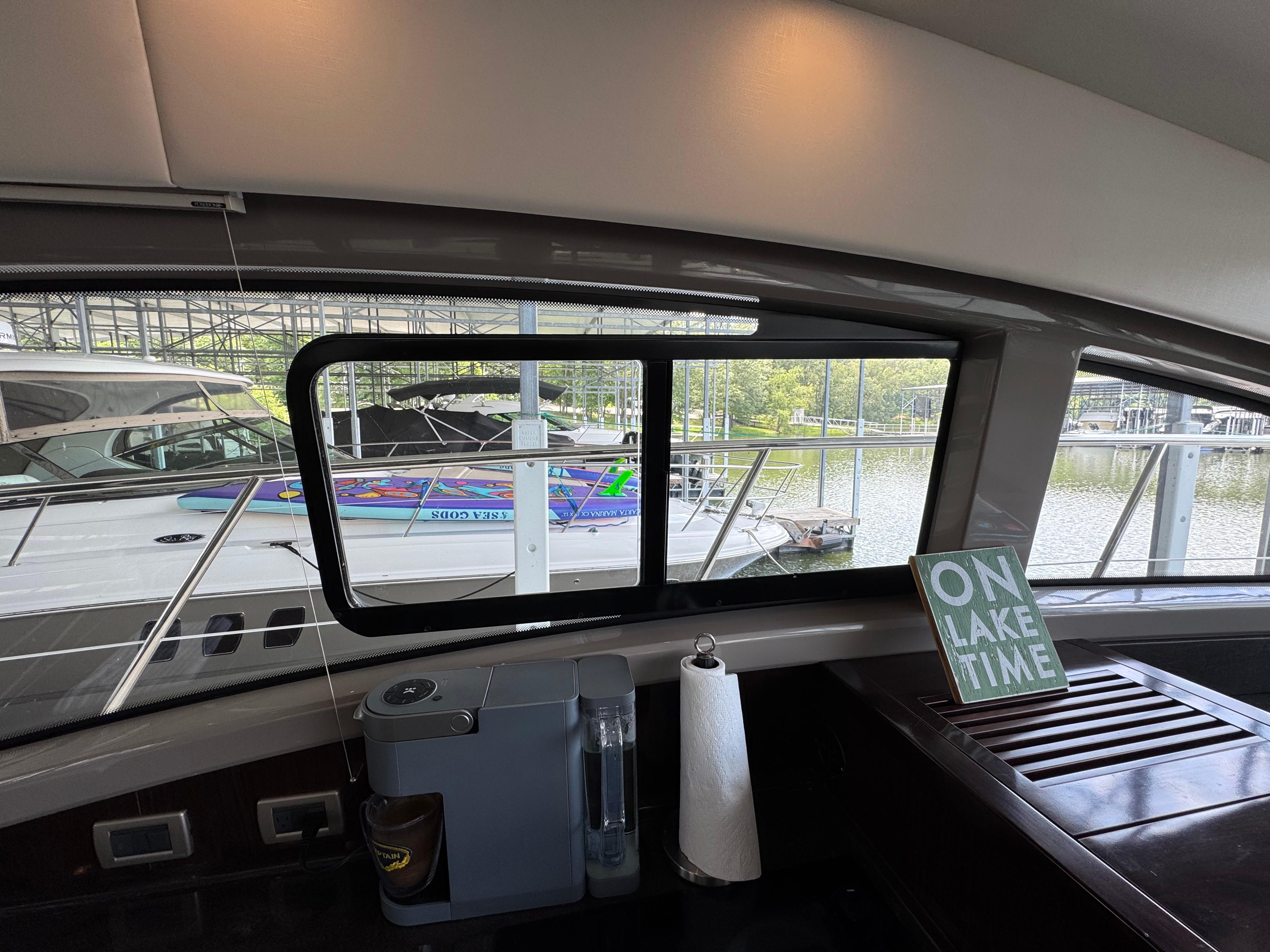 Interior view of 2017 Sea Ray Sundancer 400 yacht with lake scenery outside.