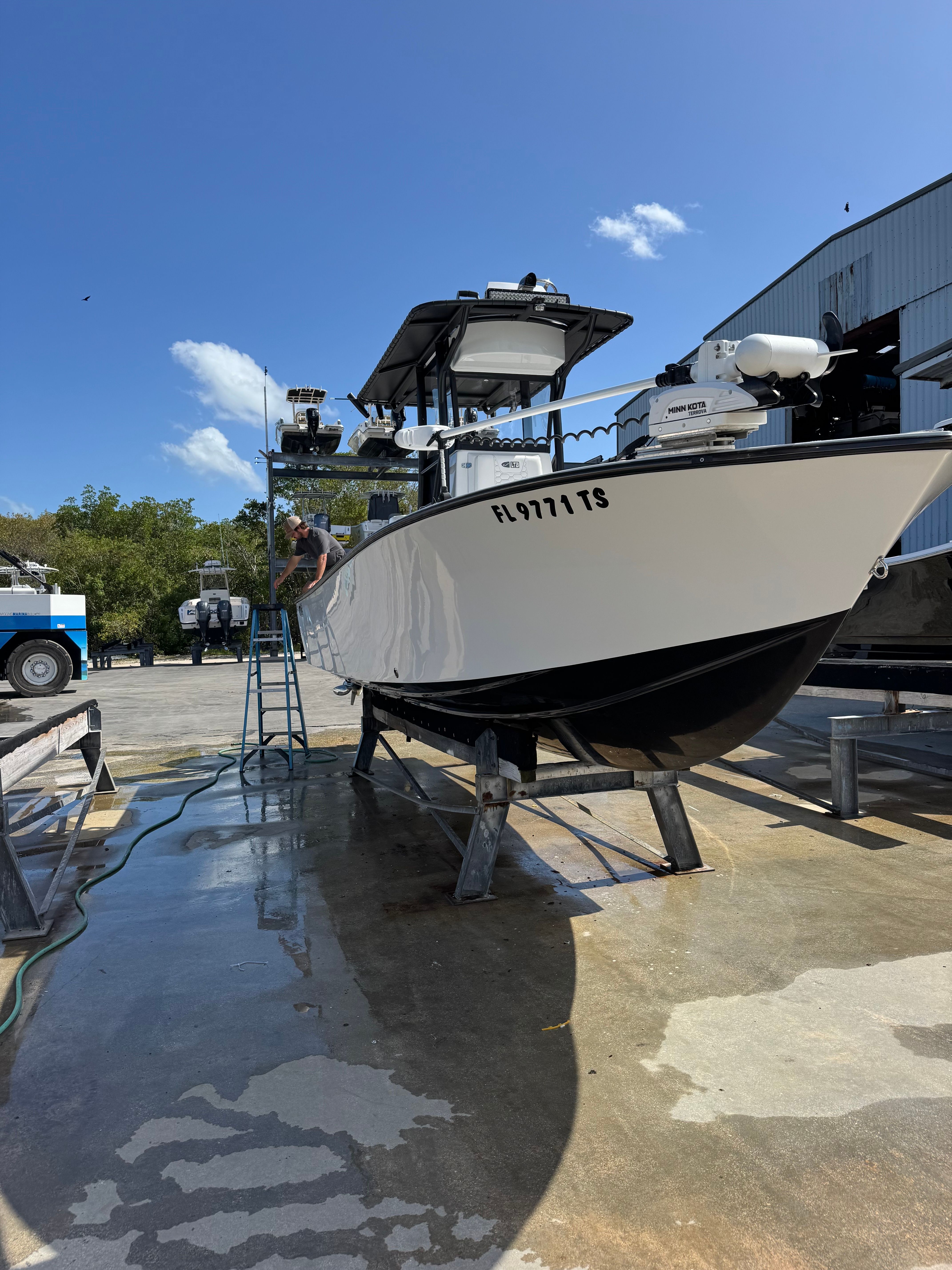 2024 Latitude Tournament Boats 25' CC on dock, side view.
