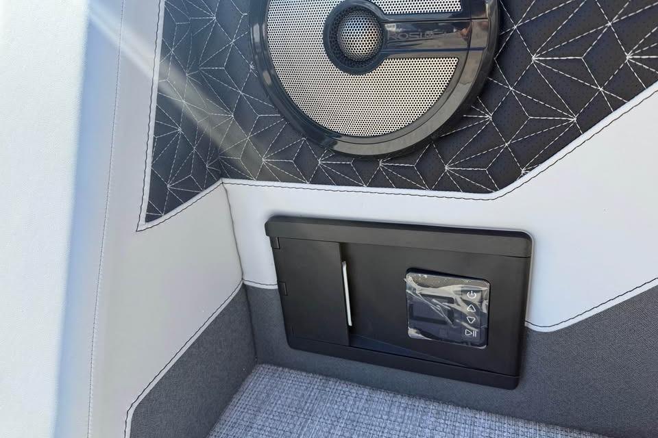 Interior detail of 2026 Alera M 25Q with speaker and control panel.