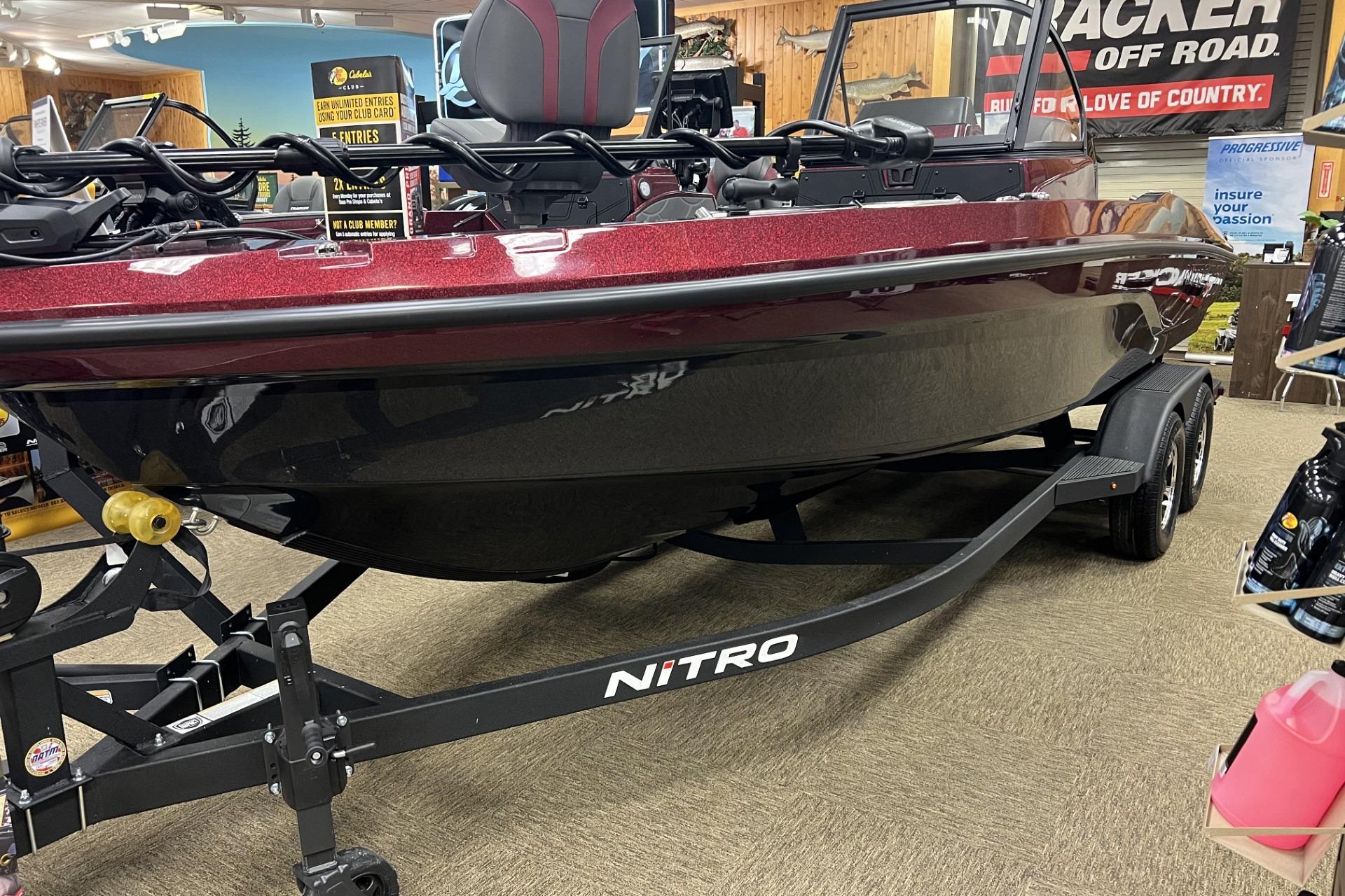 2026 Nitro ZV20 Pro boat on display in a showroom with trailer.