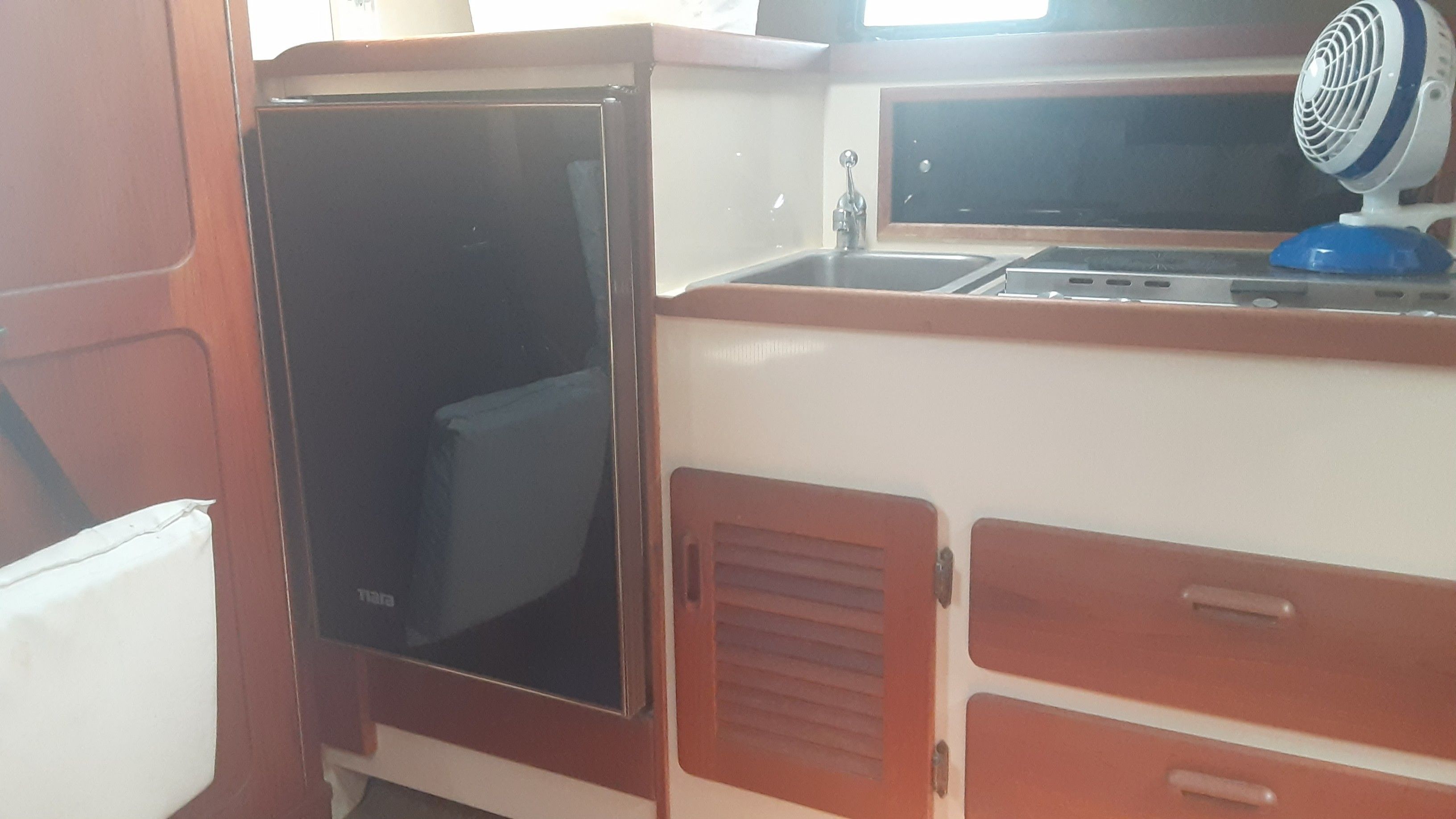 Interior of 1985 Tiara Yachts 3100 Open with kitchenette.