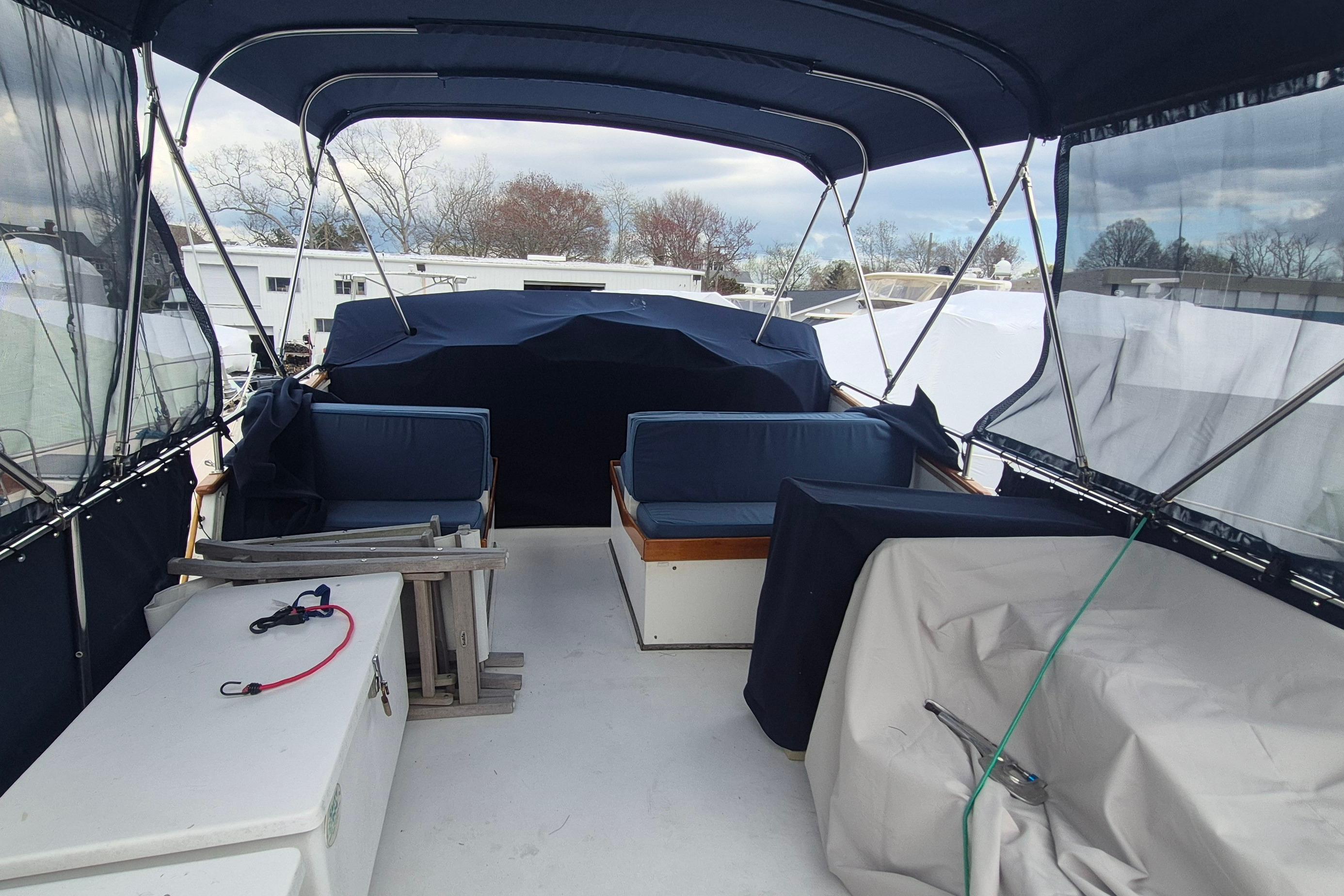 1983 Grand Banks 42 Motoryacht deck with covered seating and canopy.