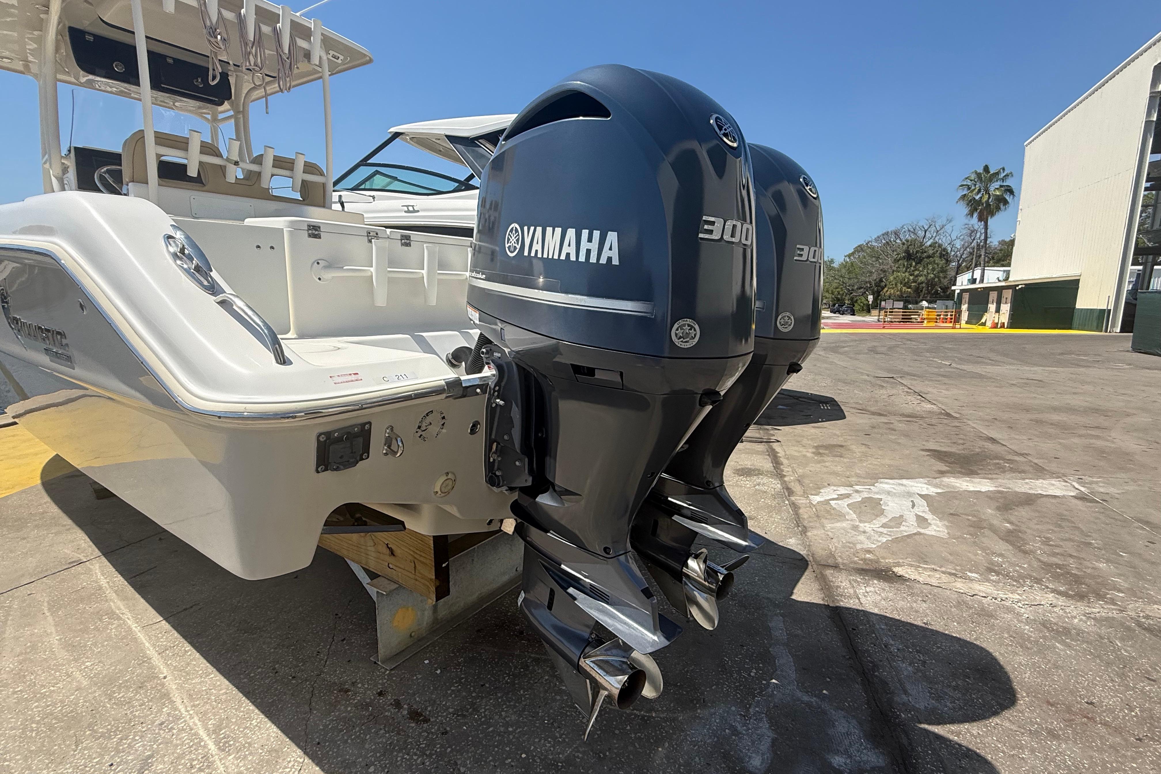 2019 Key West Billistic 281 Center Console with dual Yamaha 300 engines, docked outdoors.