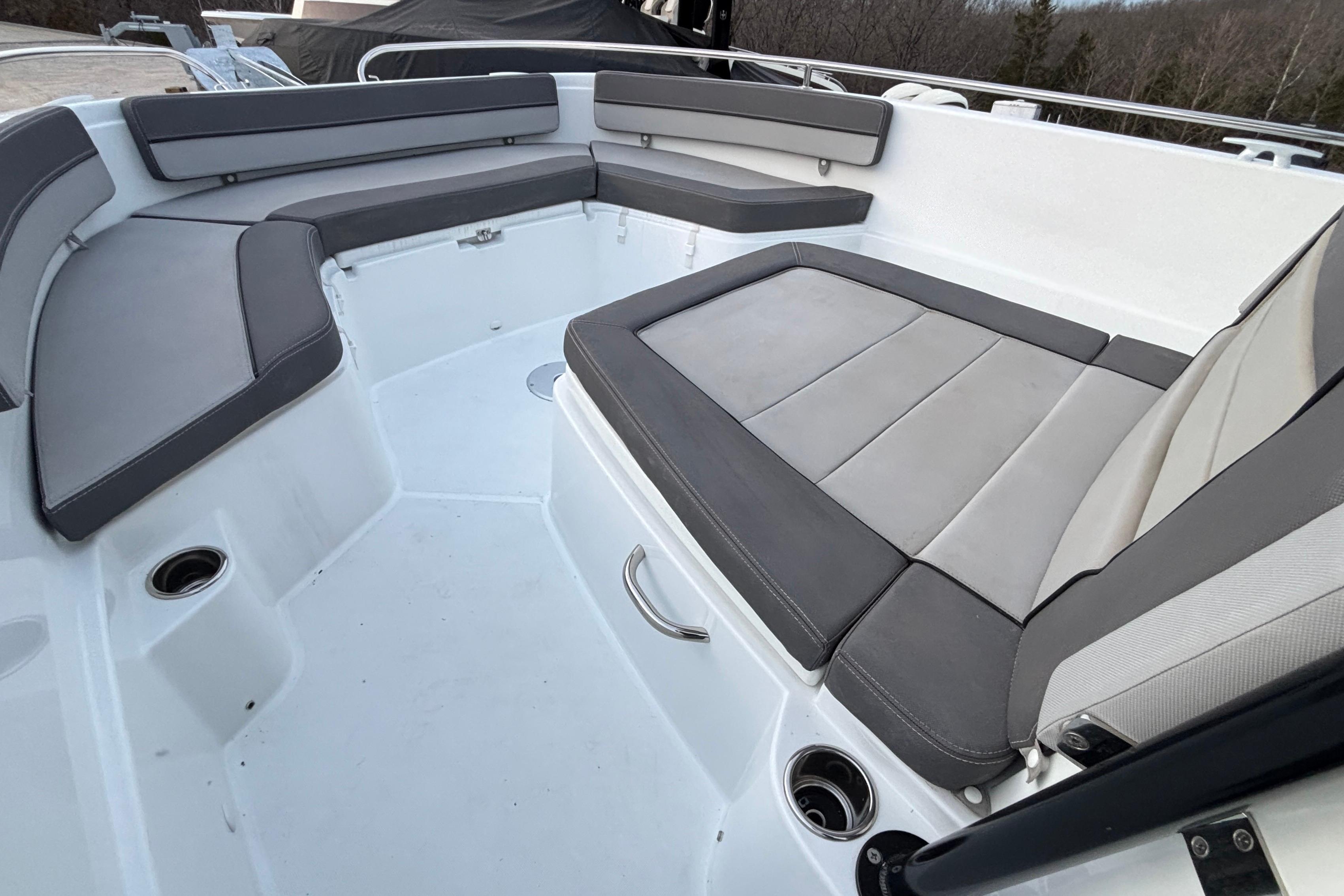 2022 Jeanneau Leader 9.0 CC boat interior with gray cushioned seating.