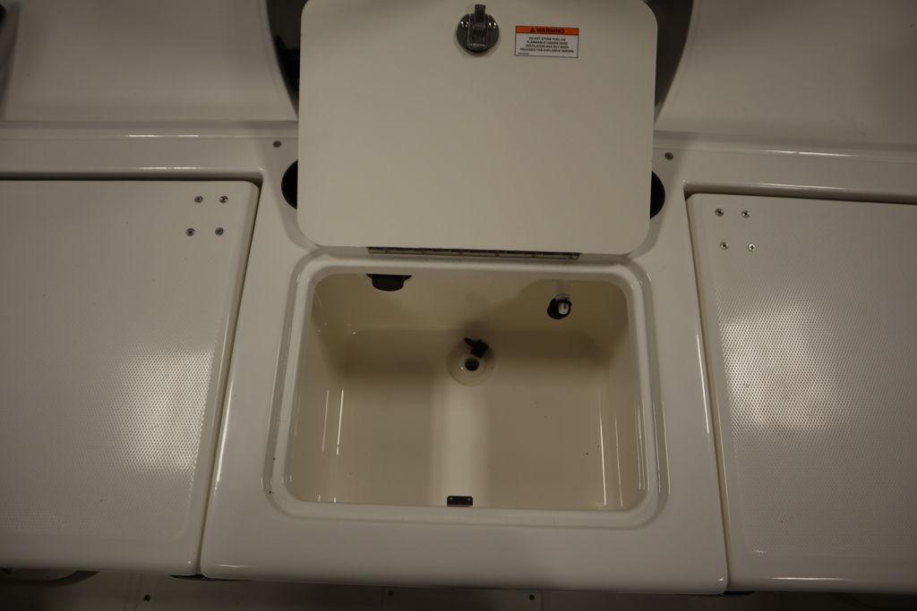 Open storage compartment on 2026 Bayliner Trophy T20CC boat.