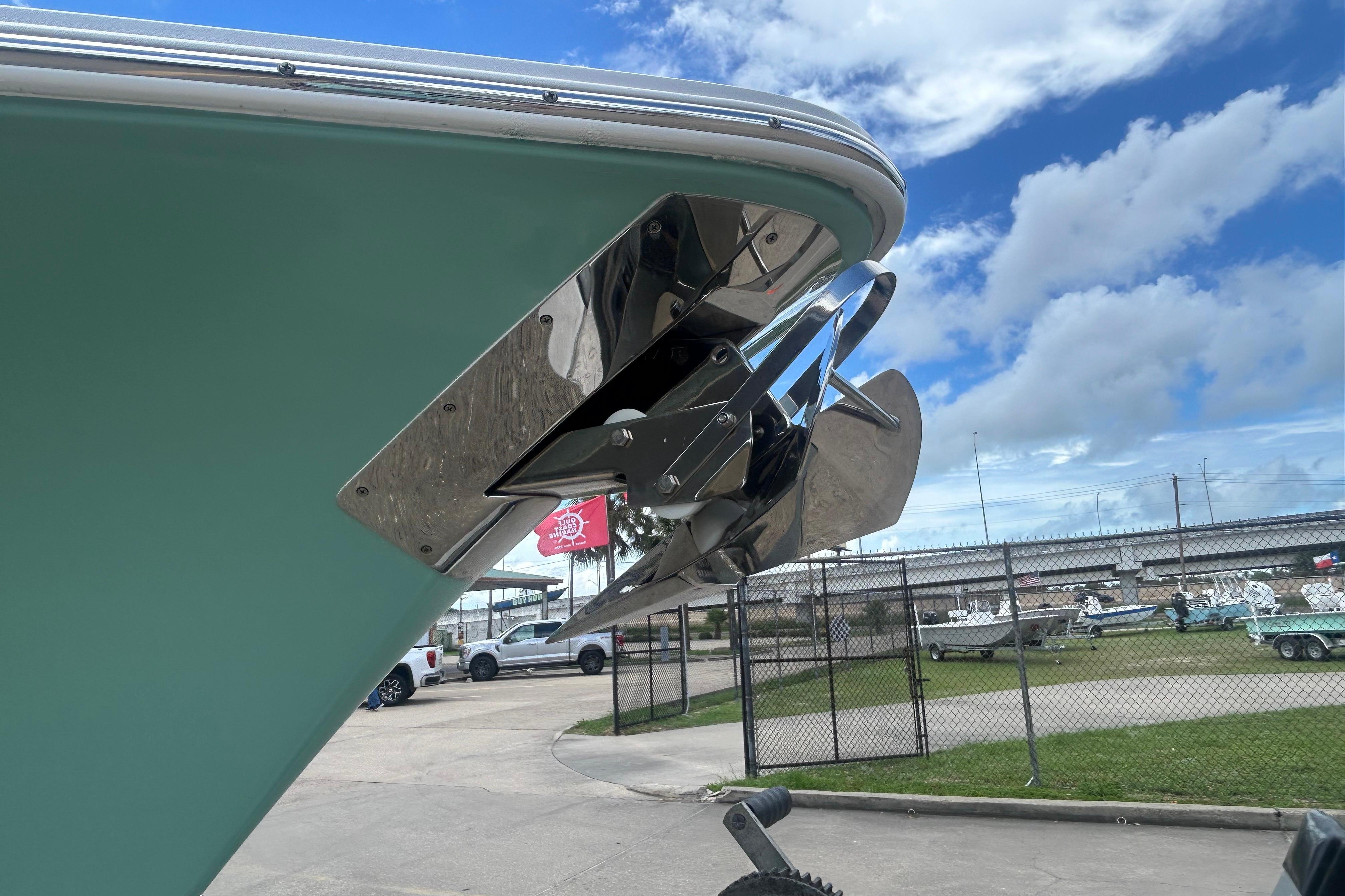 2023 Sea Hunt Gamefish 27 Coffin Box boat anchor detail against a cloudy sky.