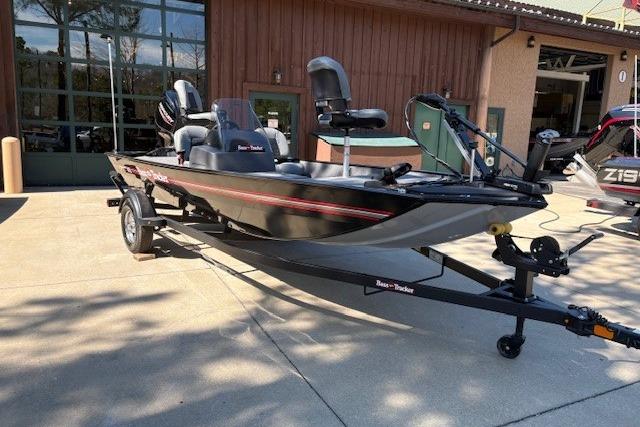2026 Tracker Bass Tracker Classic XL boat on trailer, parked outdoors.