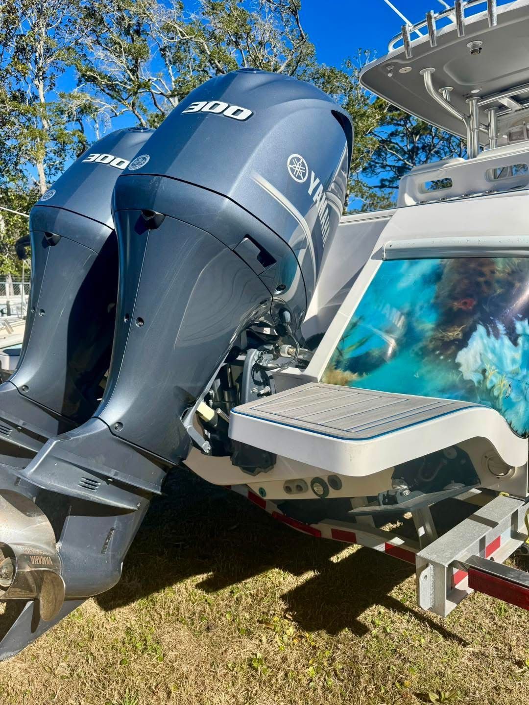 2021 Intrepid 327 Nomad with Yamaha 300 engines outdoors.