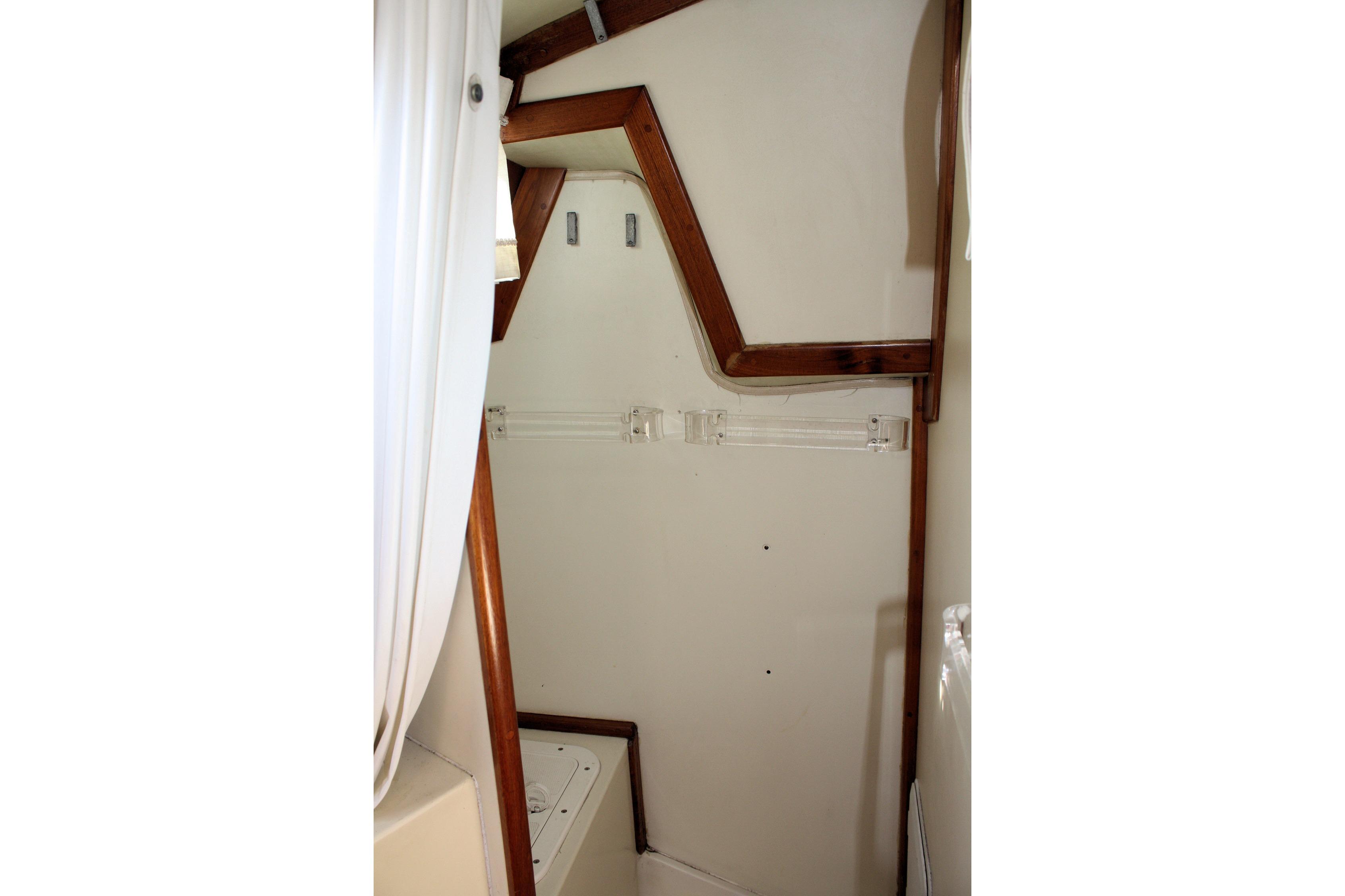 Interior of 1987 Ericson 38-200 sailboat with wooden trim and white walls.
