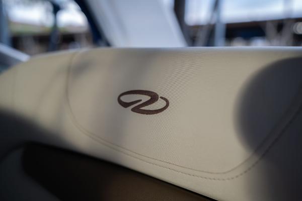 Close-up of 2016 Regal 28 Express boat seat with logo.