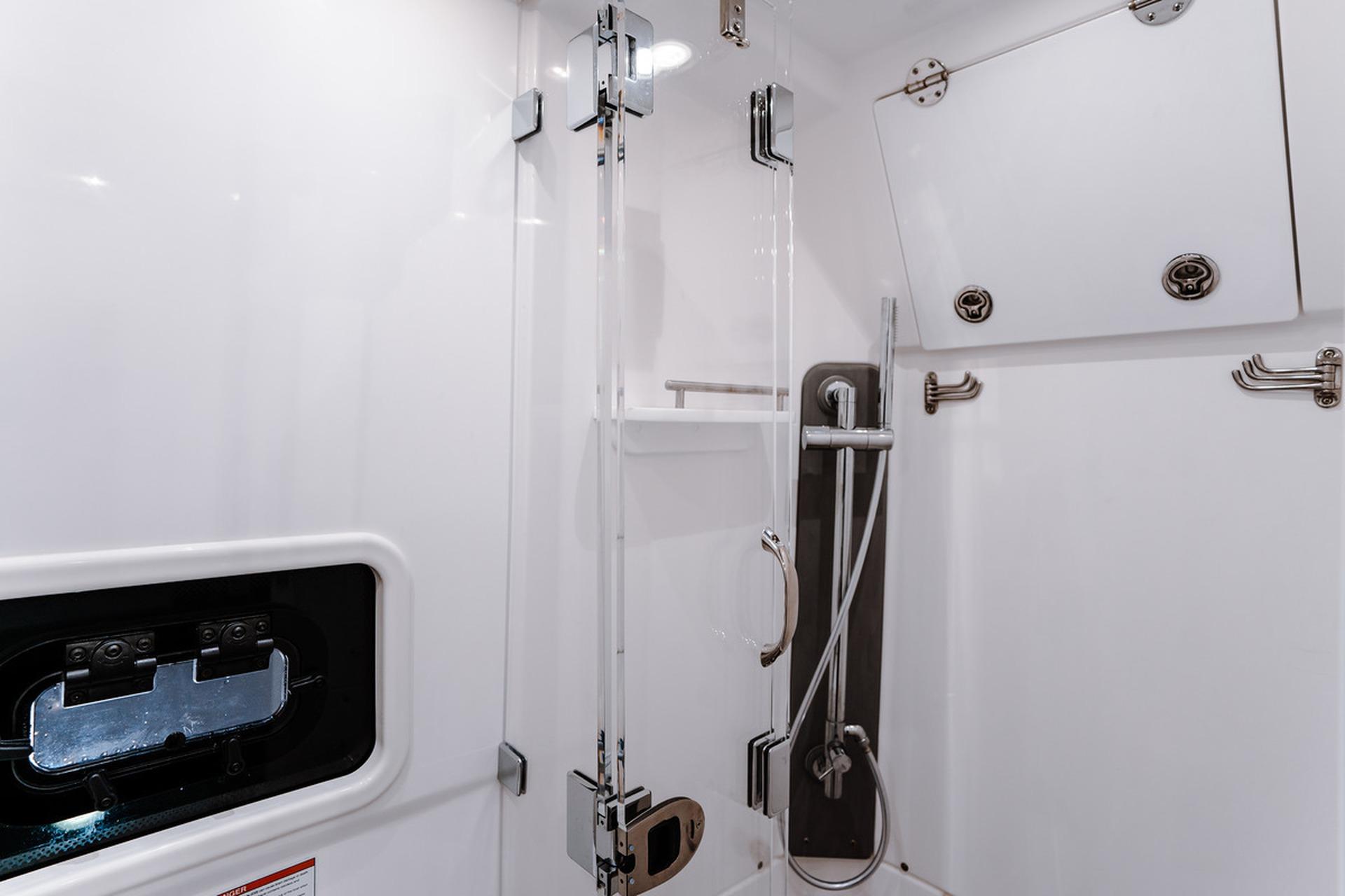 Interior of 2026 Everglades 455 Center Console boat, featuring a modern shower area.