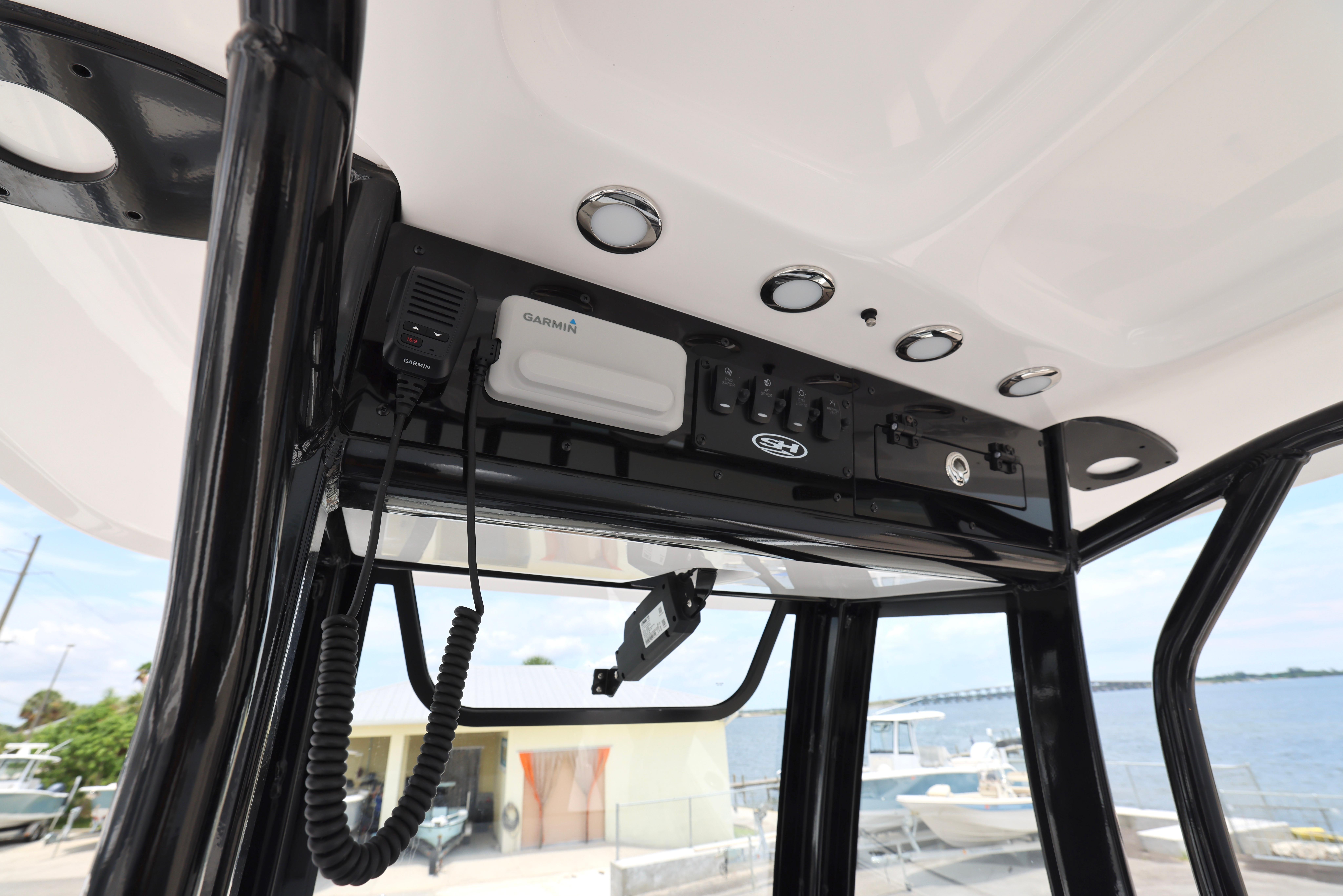 2026 Sea Hunt Ultra 245 SE boat console with Garmin electronics and controls.