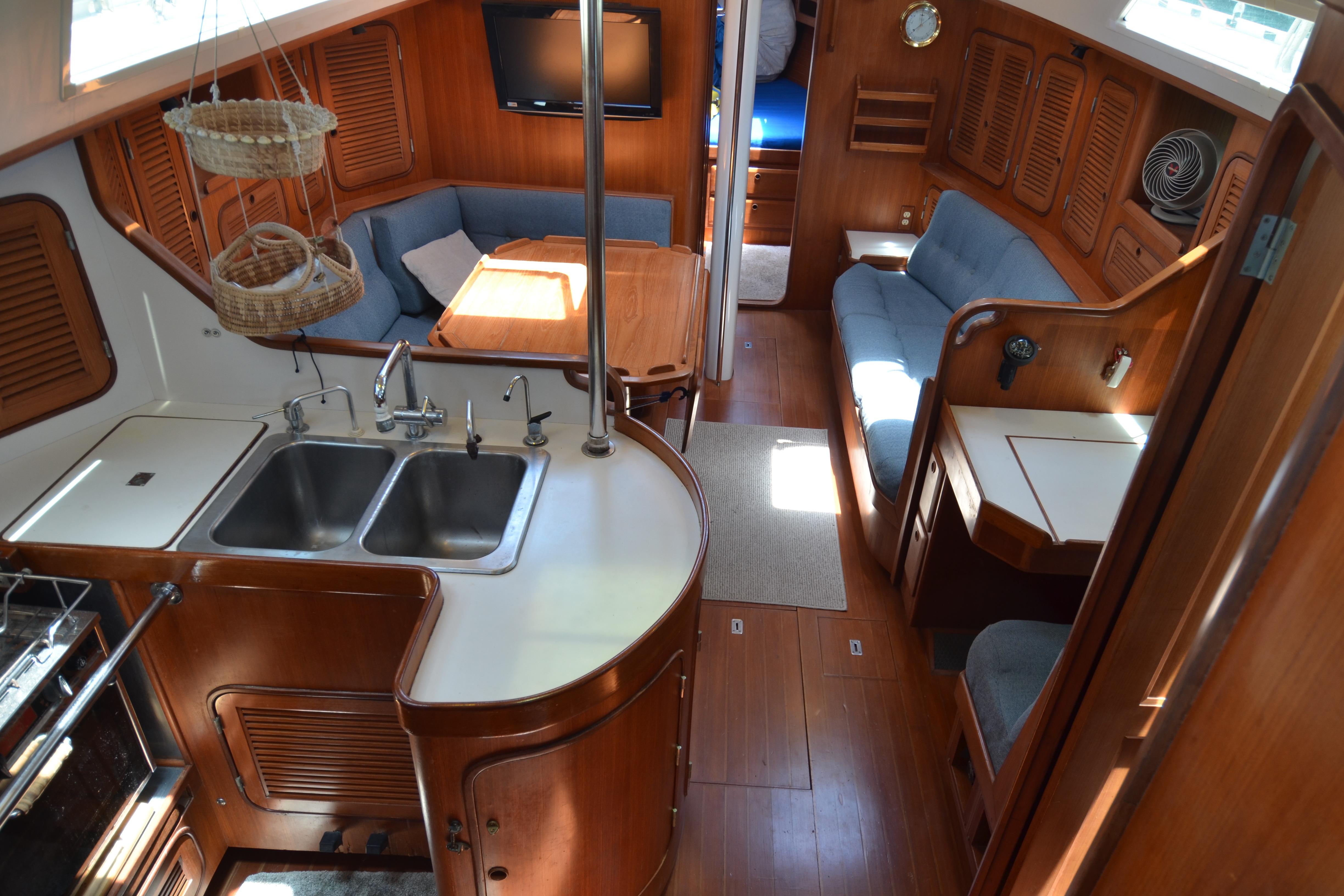 Interior of 1987 Norseman 400 yacht with wood finish and cozy seating area.