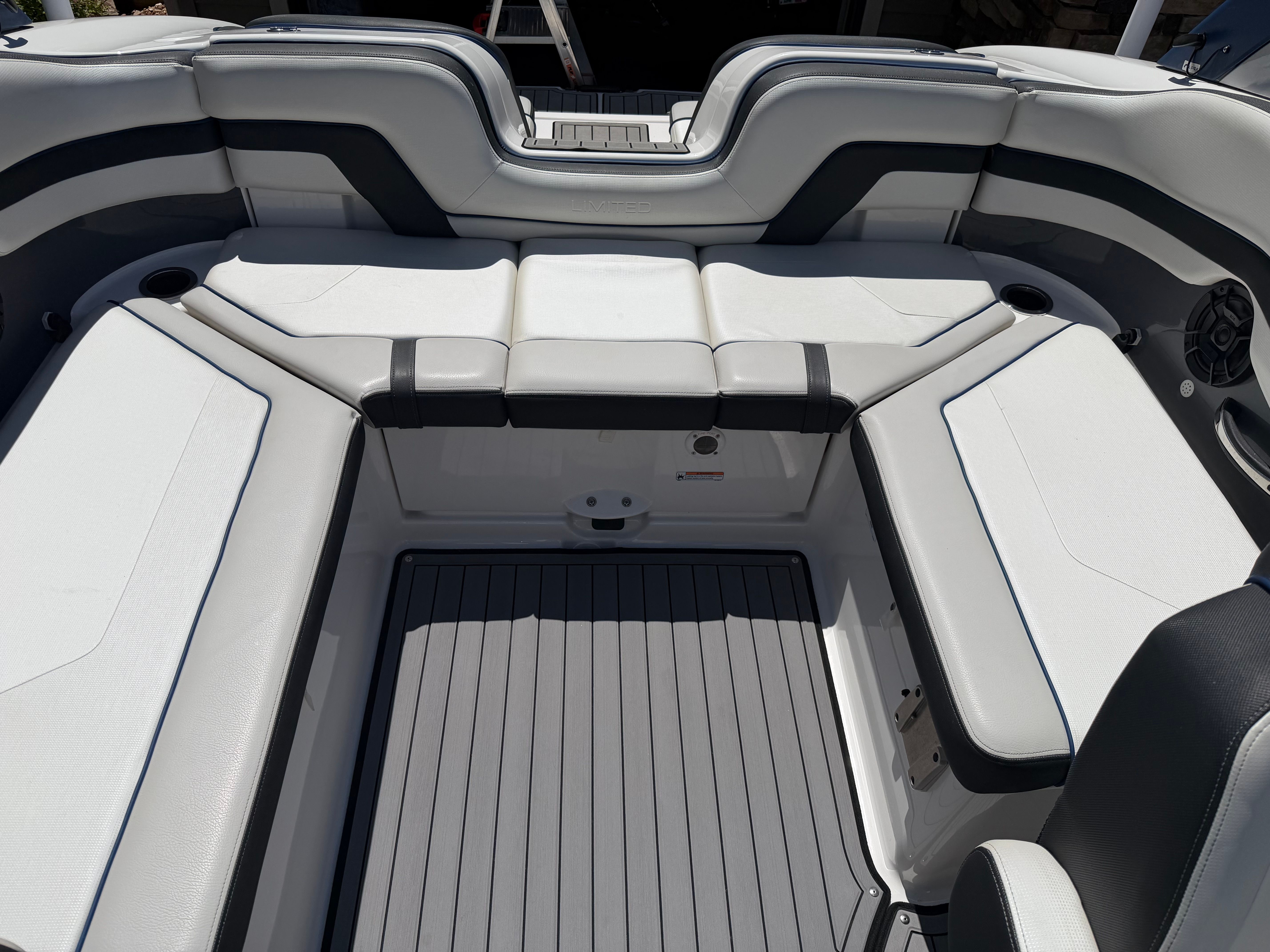 The image shows the interior of a 2018 Yamaha 242 Limited S boat with gray and white upholstery.