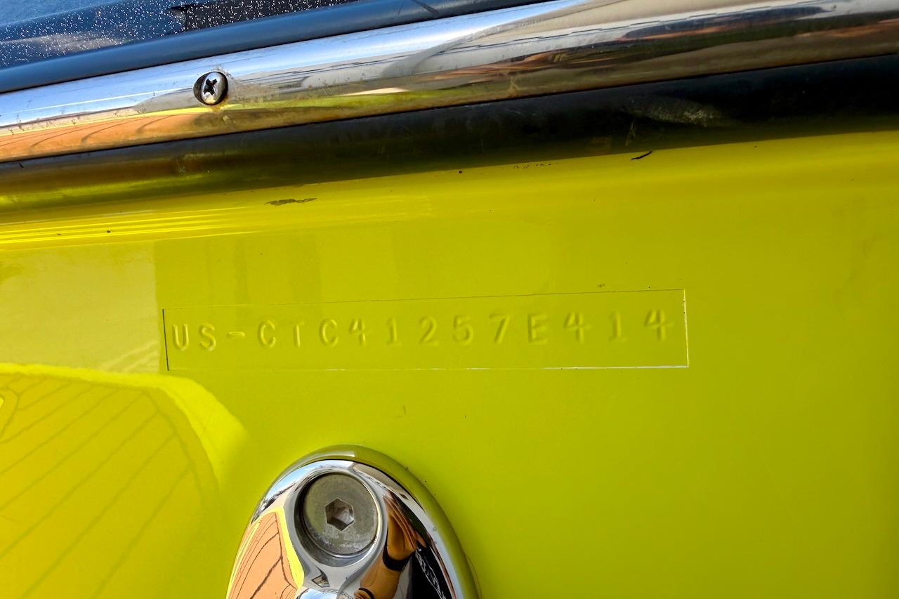 2014 Nautique Super Air Nautique G21 hull identification number on yellow surface.