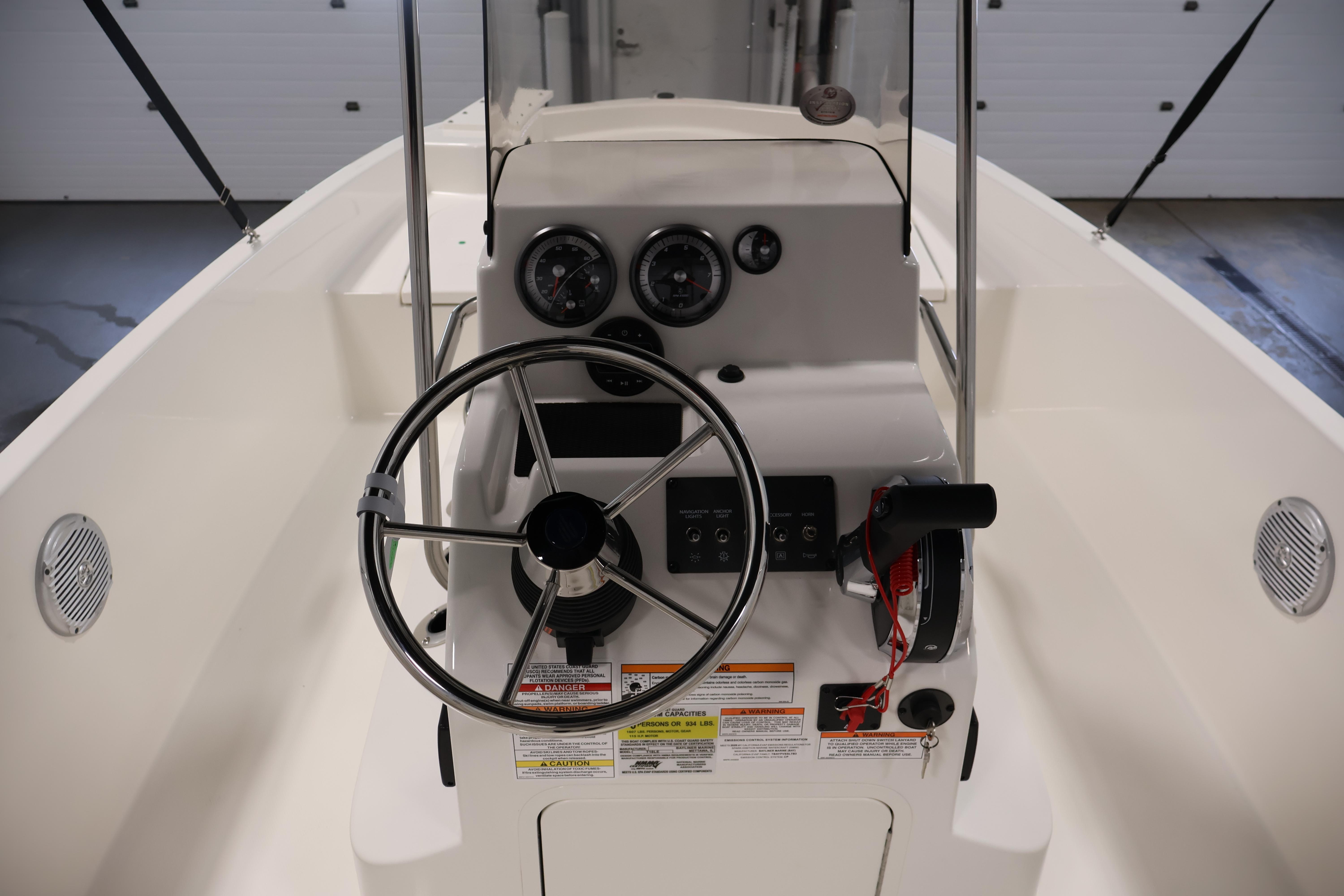 2026 Bayliner Trophy T18 boat helm with steering wheel and control panel.