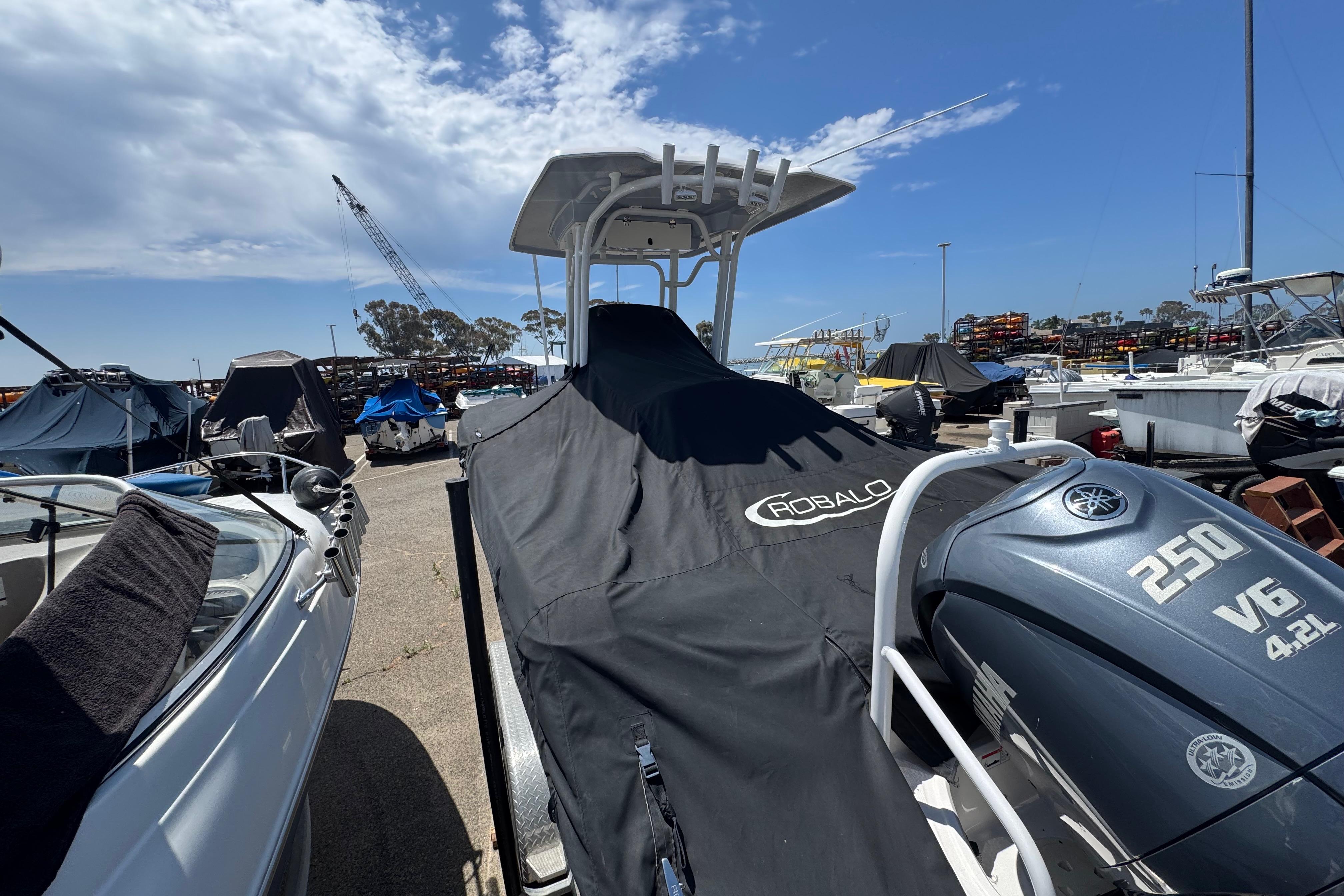 2022 Robalo R230 Center Console boat with Yamaha 250 V6 engine, covered and docked.