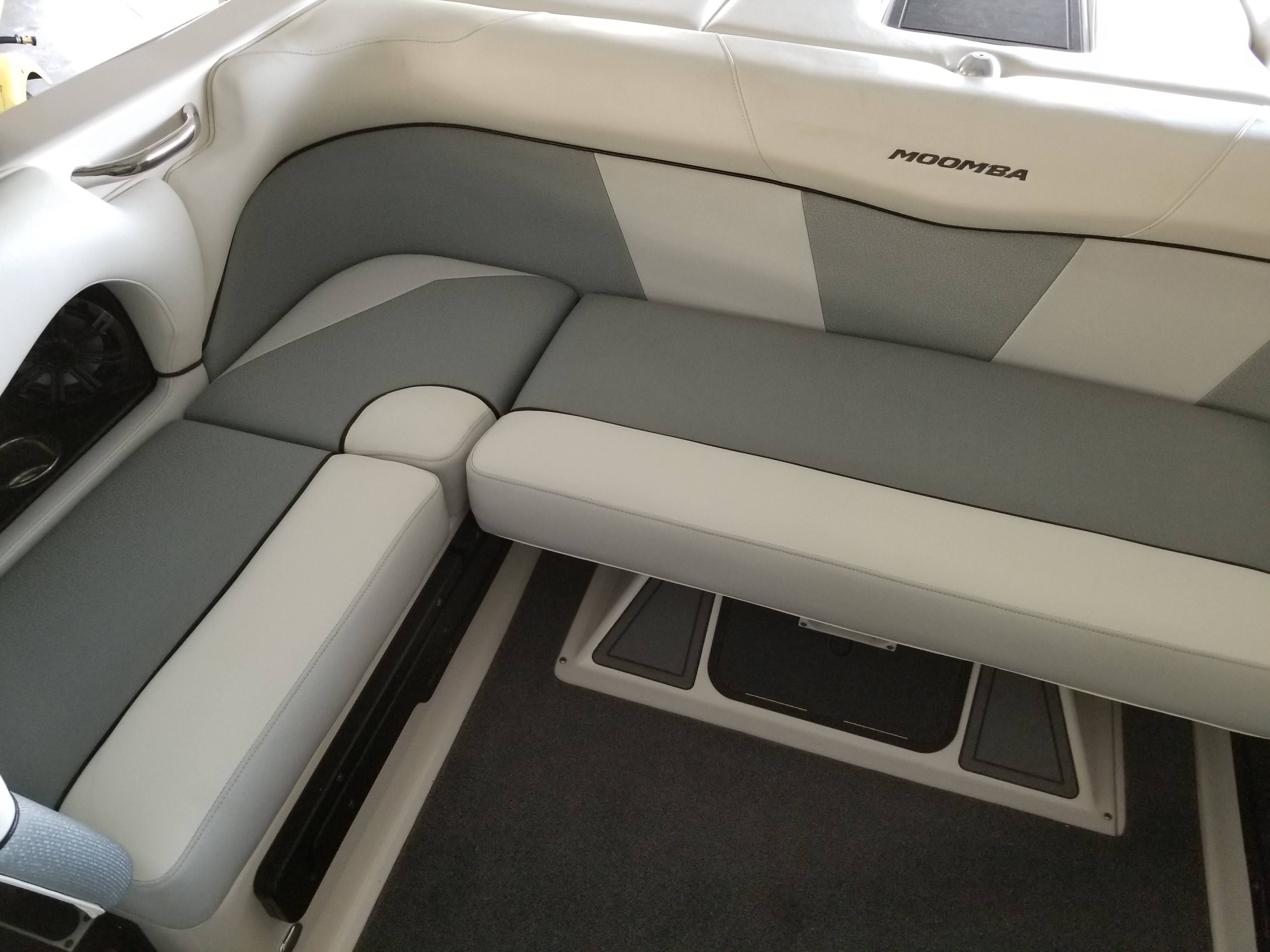 Interior of a 2016 Moomba Mondo with gray and white upholstery.
