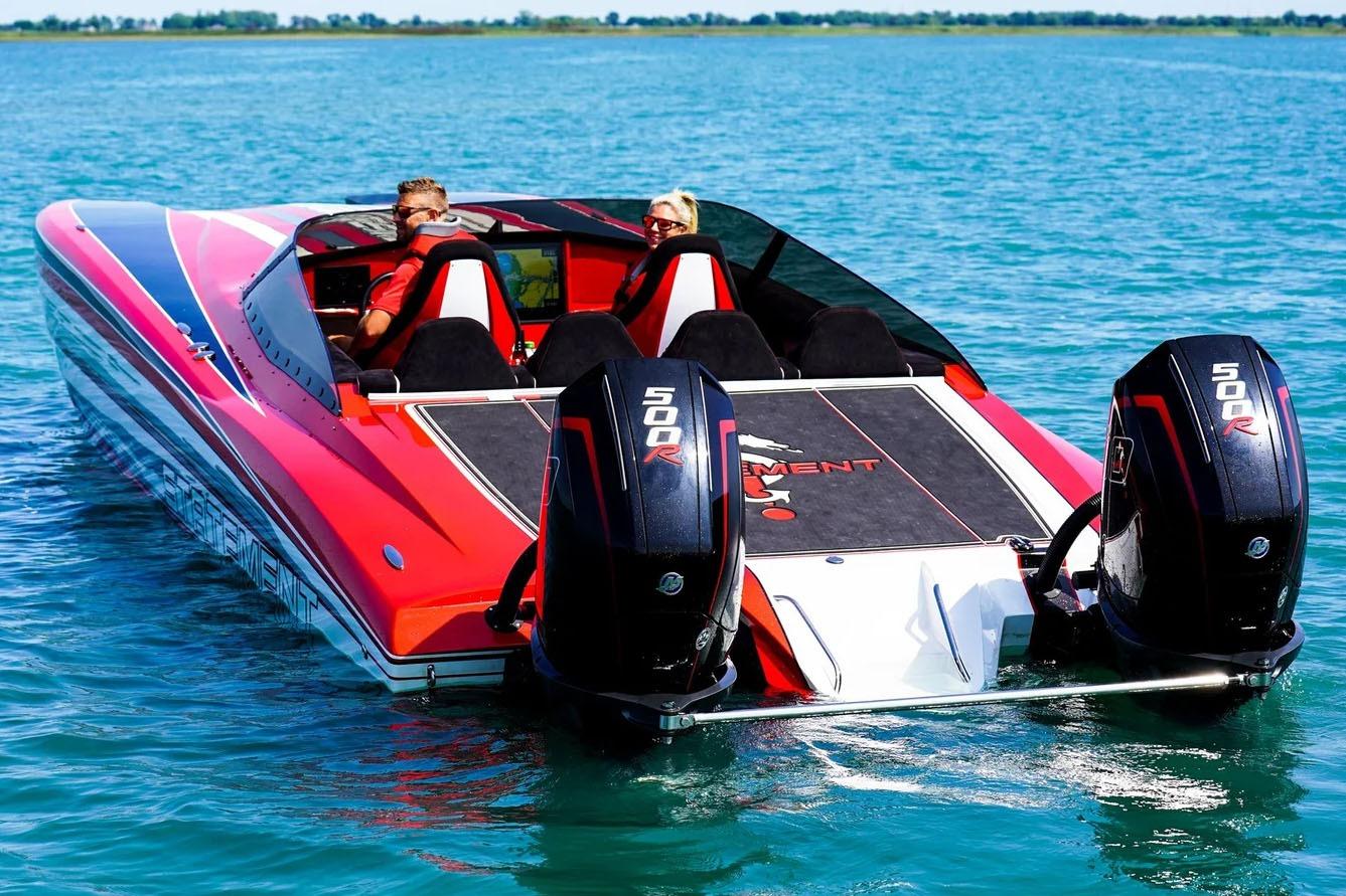 Manufacturer Provided Image: Red Statement 360 CAT boat with dual 500R engines on blue water.