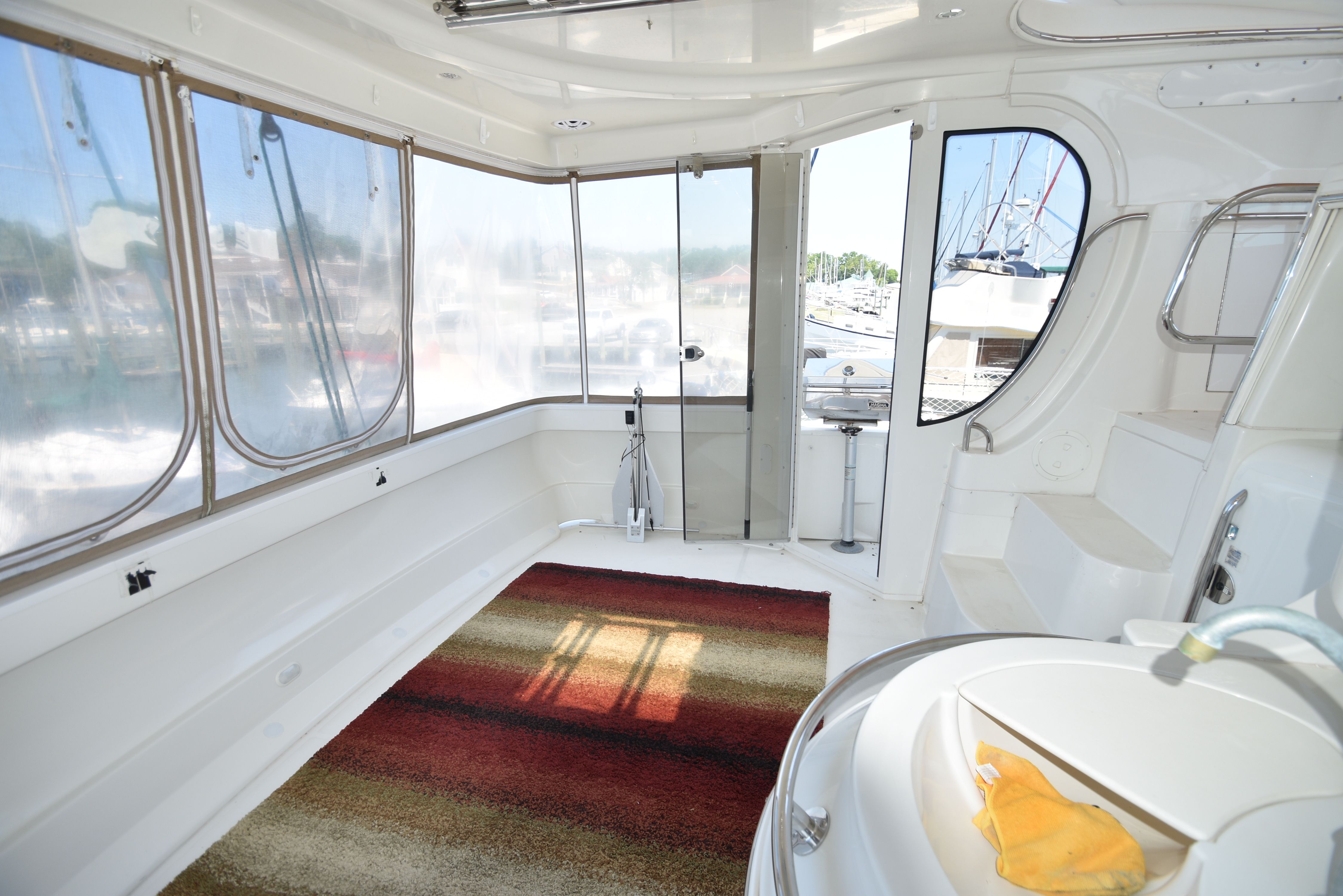 Interior of a 2004 Carver 466 Motor Yacht with carpet and windows.