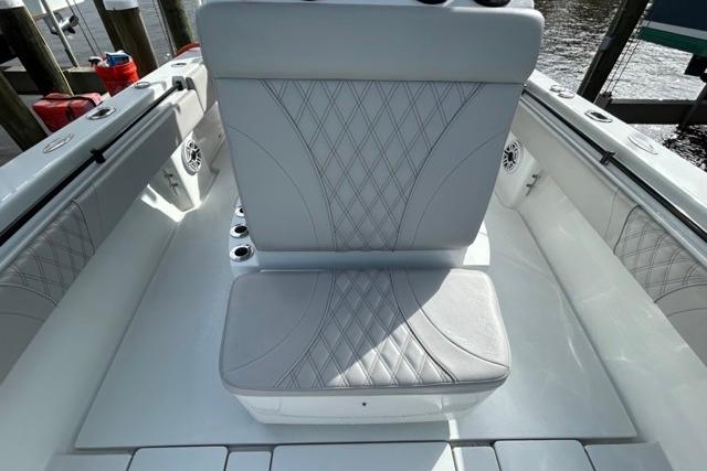 2023 Contender 32 ST boat interior with stylish seating and diamond-pattern upholstery.