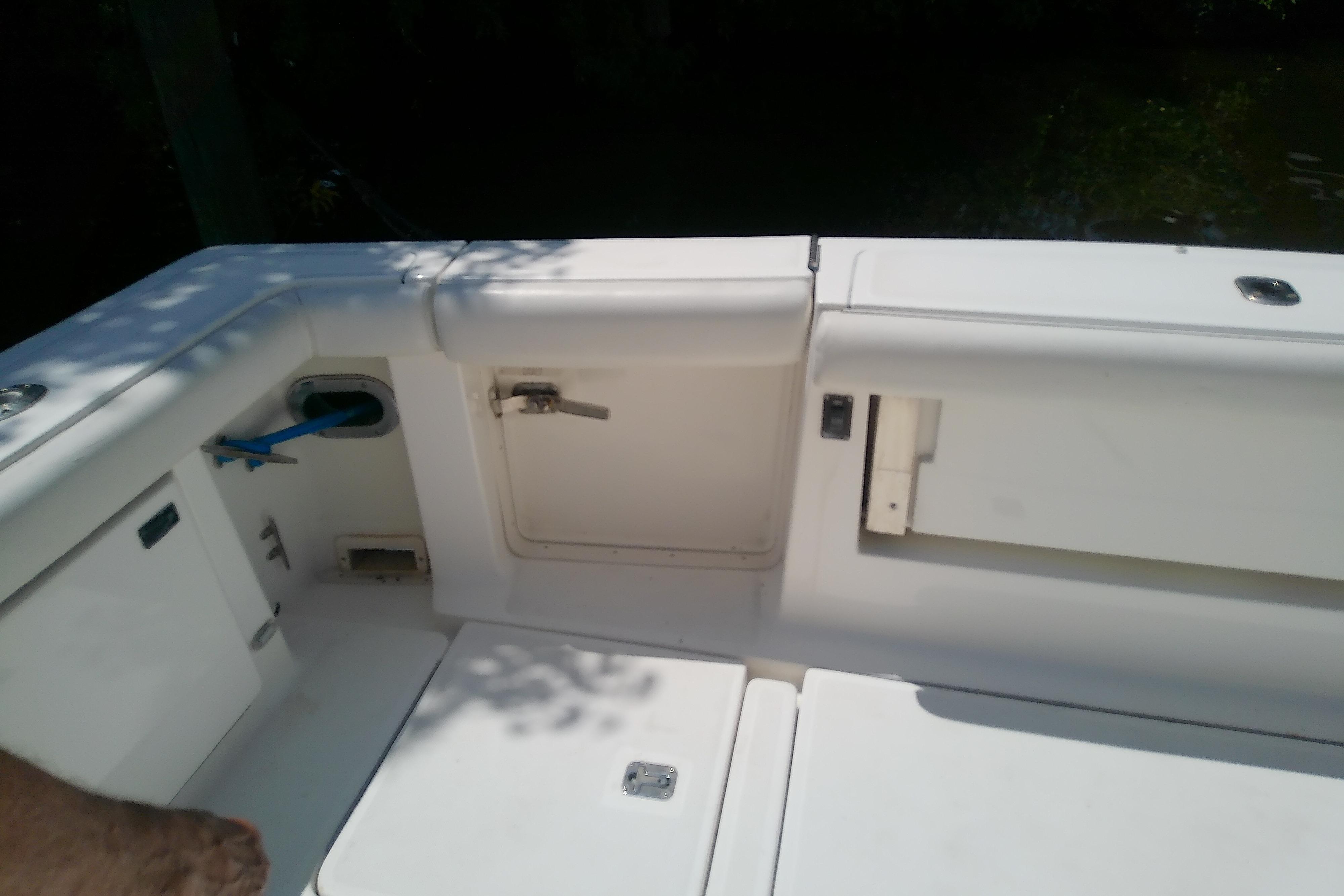 2000 Tiara Yachts 4100 Open cockpit area with storage compartments and seating.