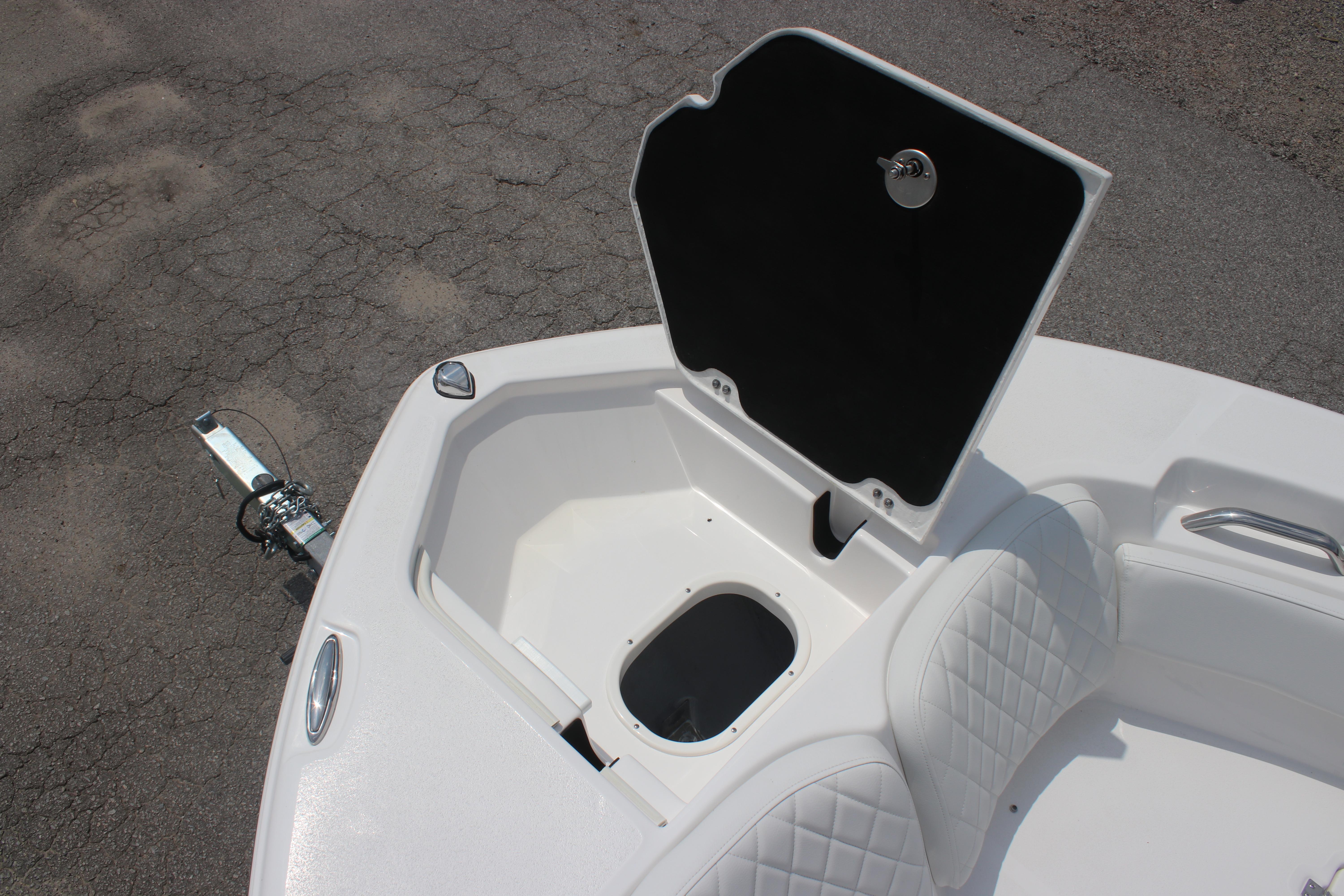 2026 Sea Fox 248 Commander boat storage compartment with open hatch and seating.