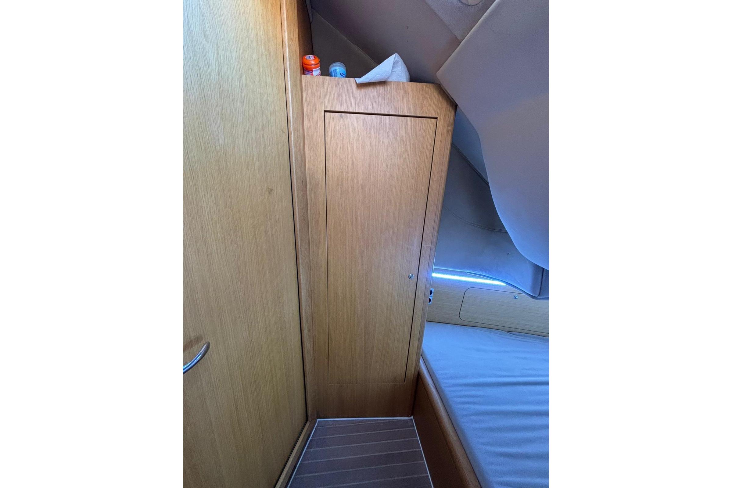Interior of 2021 Skipper SKIPPER 42 yacht cabin with wooden paneling.