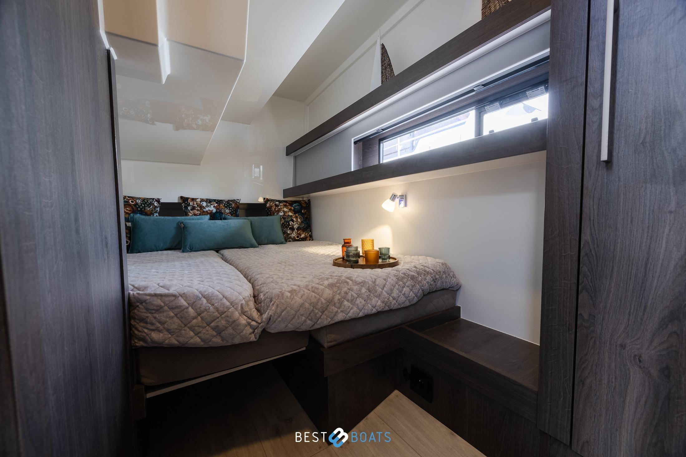 Luxurious bedroom interior of 2023 Cobra Yachts Futura 36 Premium Fly, featuring cozy bedding and modern design.