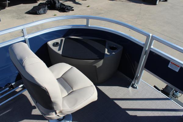 2025 Sun Tracker Fishin' Barge 22 DLX boat interior with seating and storage.