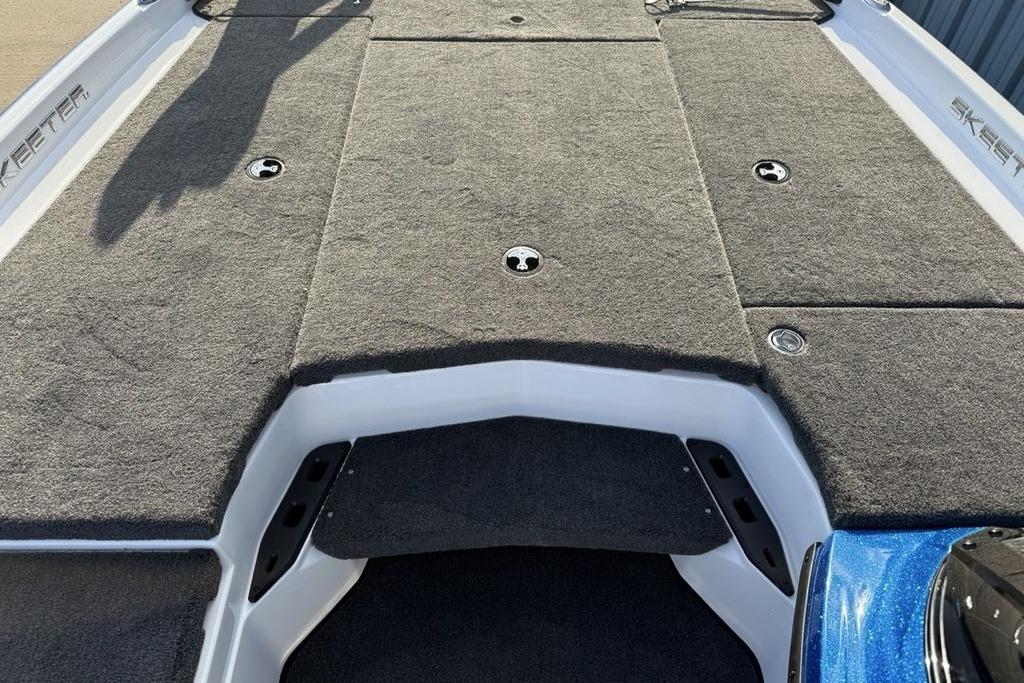 2026 Skeeter ZXR19 SE boat deck with gray carpet and storage compartments.