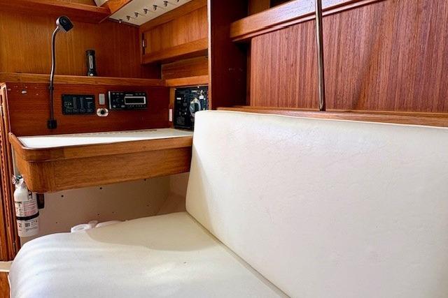 Interior of a 1992 Catalina 34 sailboat with wood paneling and navigation equipment.
