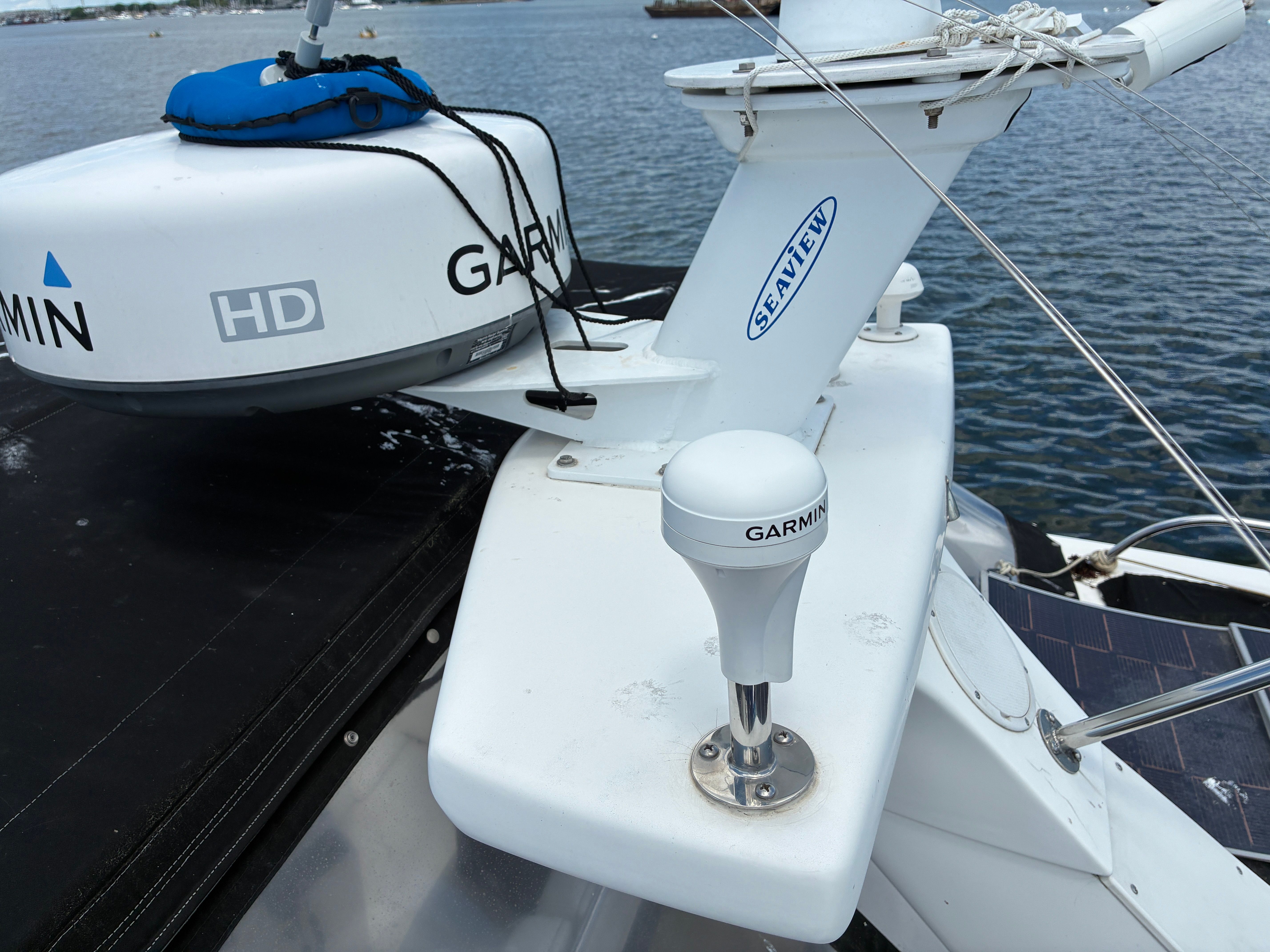 A 2001 Silverton 392 Motor Yacht with Garmin equipment on deck, on calm water.