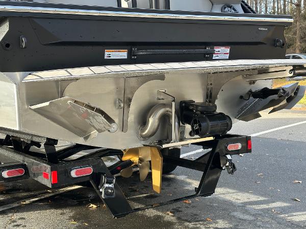 2025 Montara Surf Boss 2.0 25 boat stern with propeller and trailer.