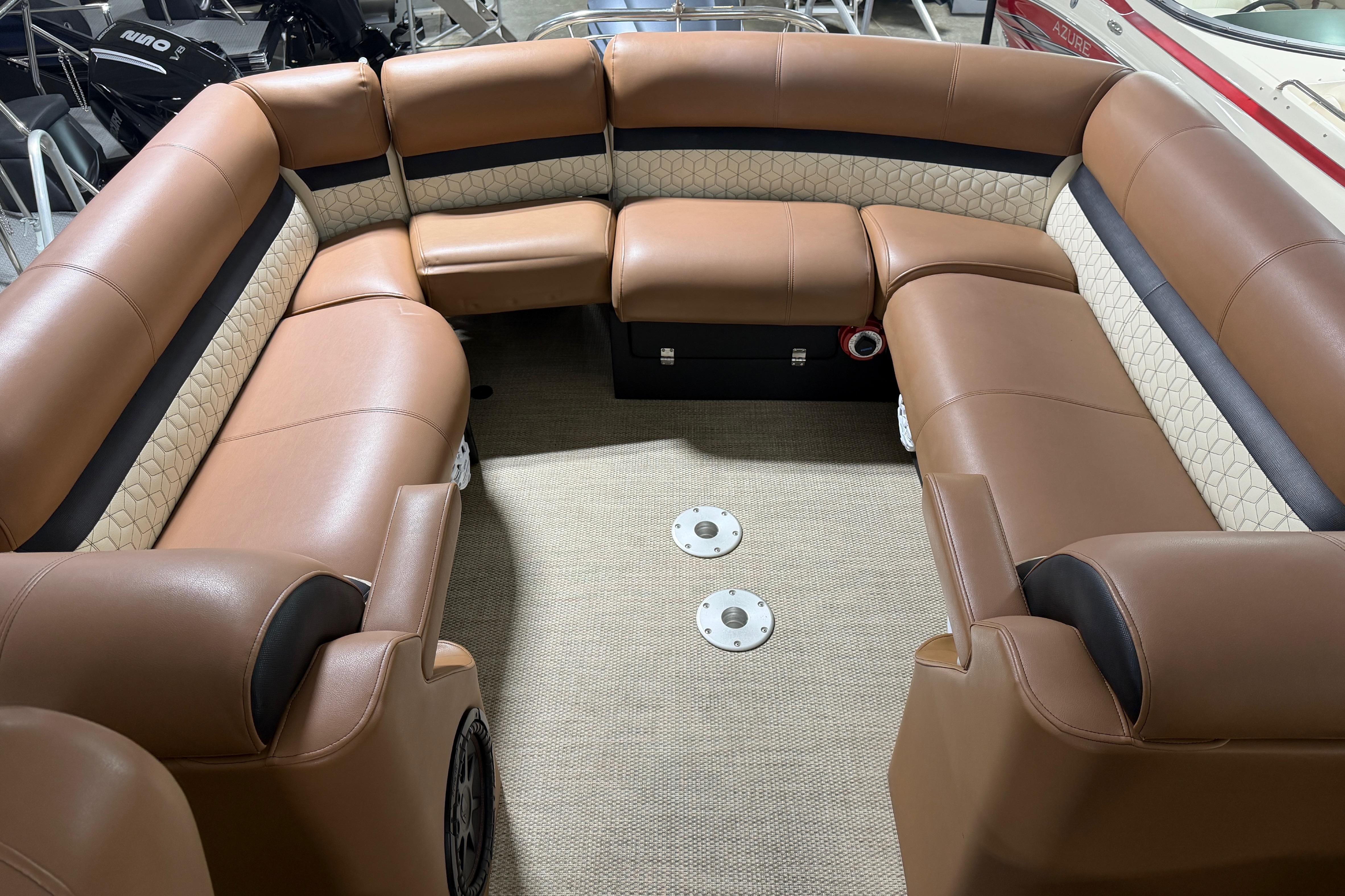 Luxurious seating on 2018 Godfrey Sanpan 2500 ULC pontoon boat, featuring tan upholstery.