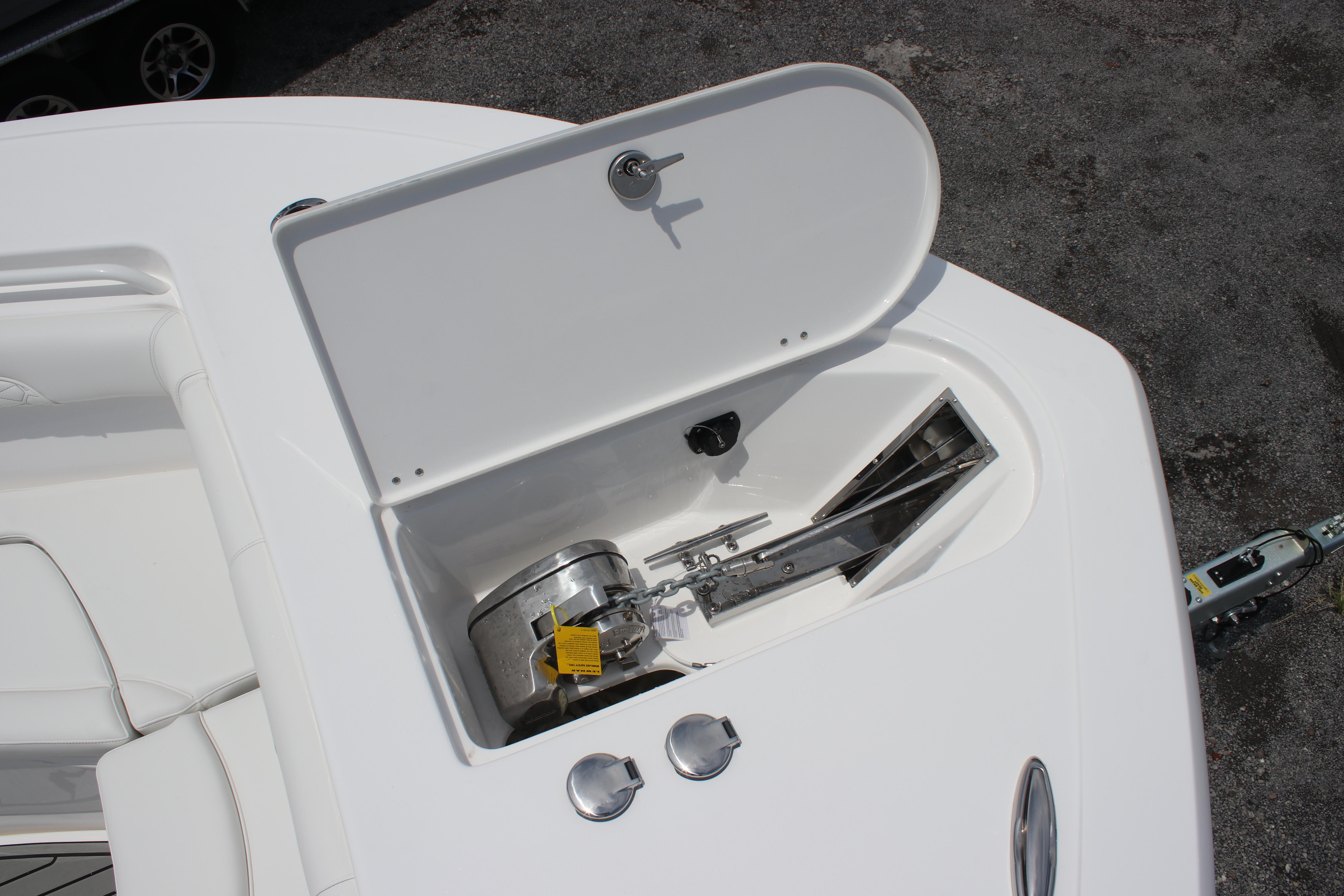 2026 Tidewater 272 LXF boat anchor compartment with open hatch, showcasing storage space.