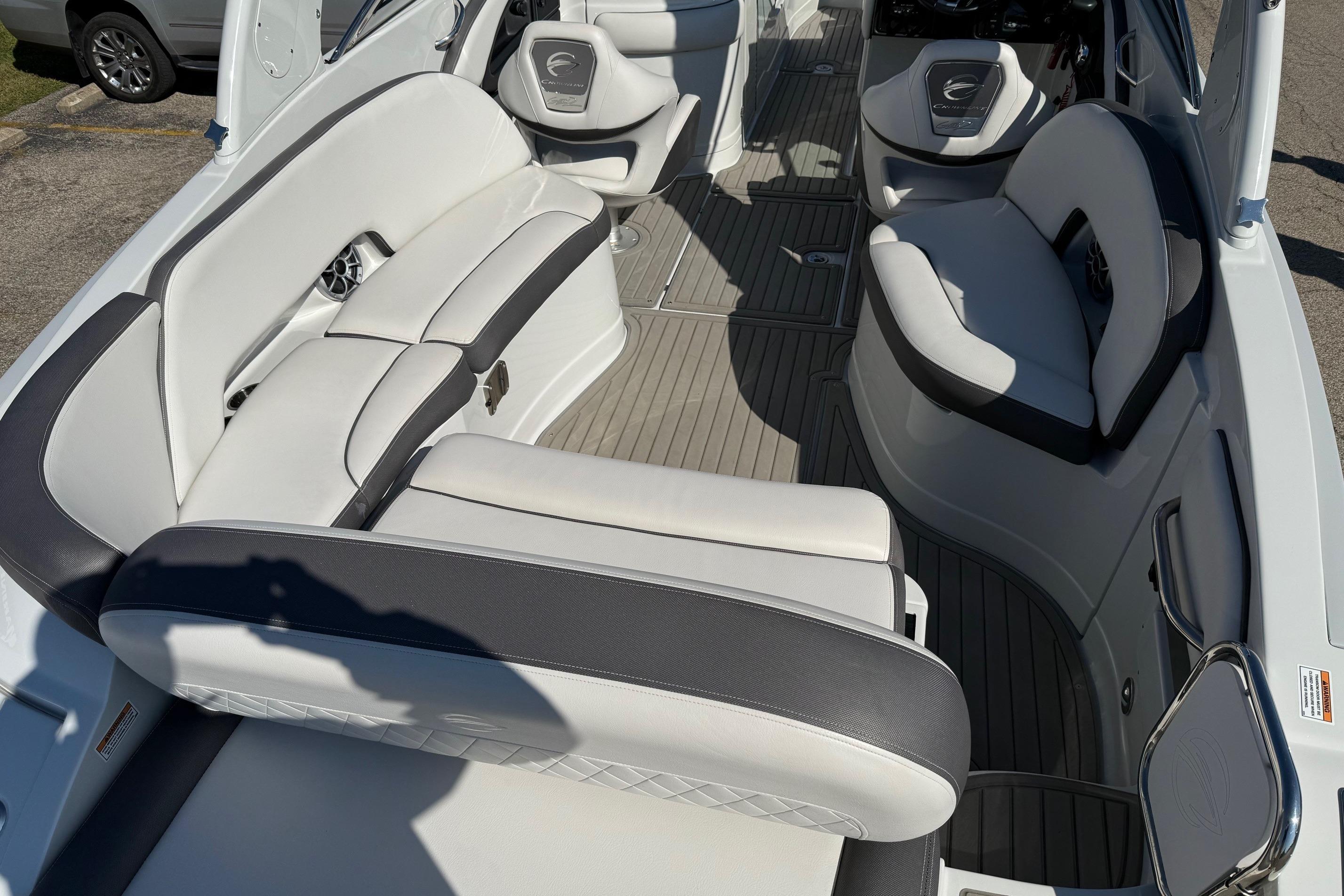 2023 Crownline 290 SS boat interior with luxurious white seating and modern design.