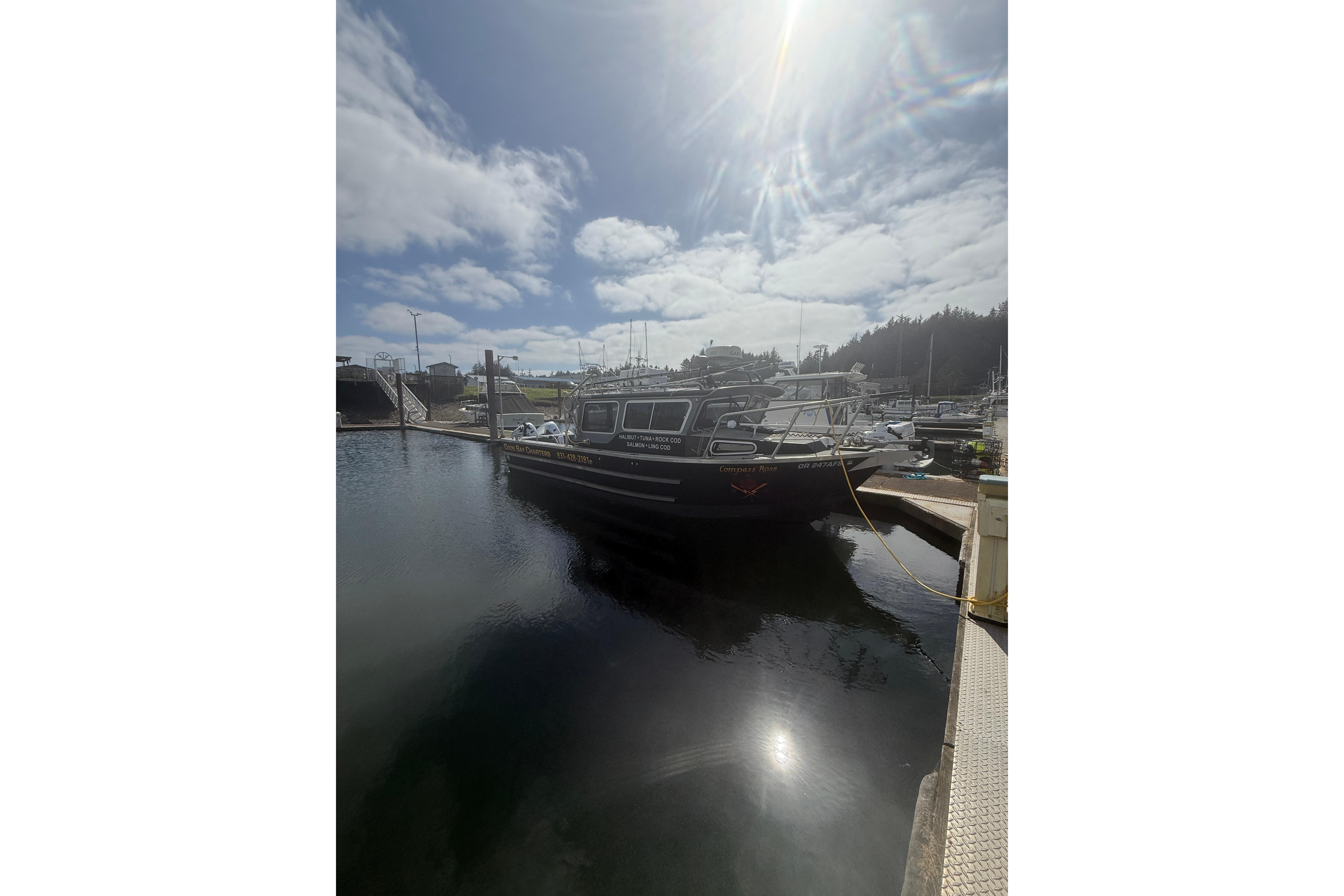 2016 North River 29 OFFSHORE boat docked under a sunny sky.