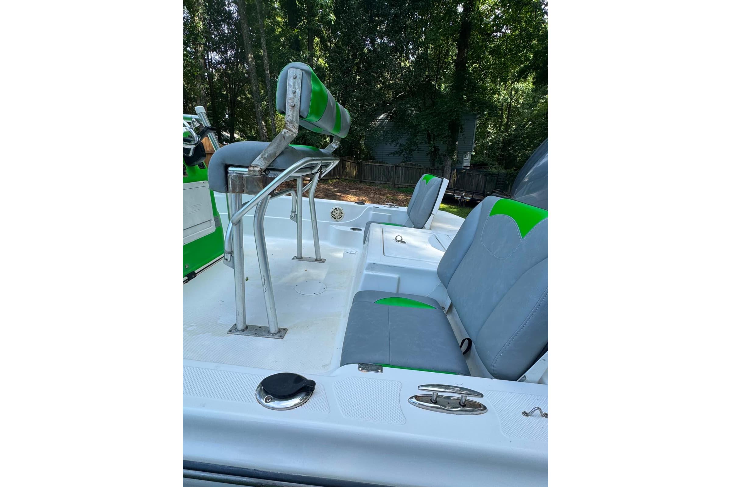 2016 Epic 21 Sport Console boat interior with green and gray seating.