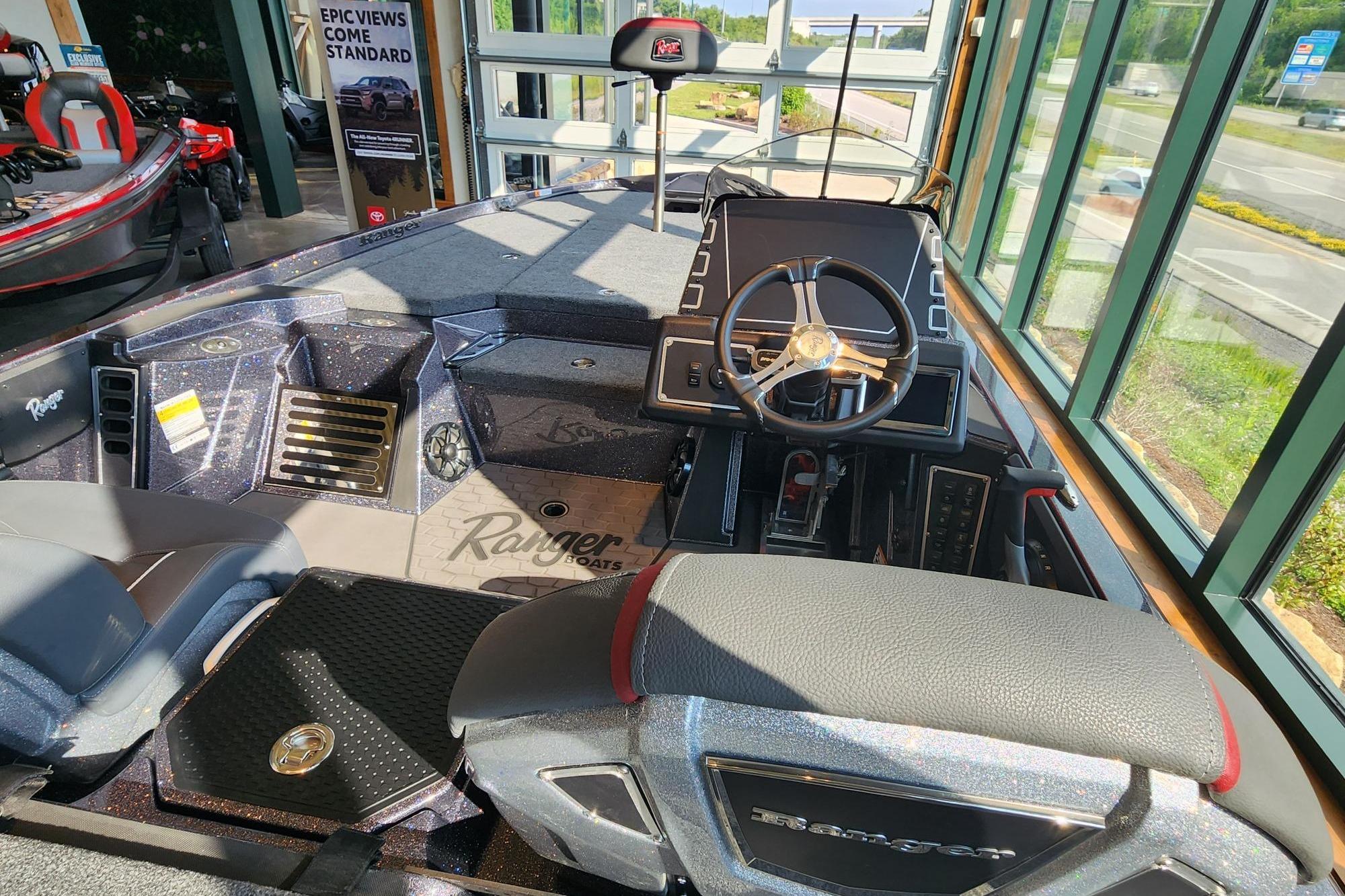 2026 Ranger Z519R boat interior with steering wheel and dashboard in showroom.