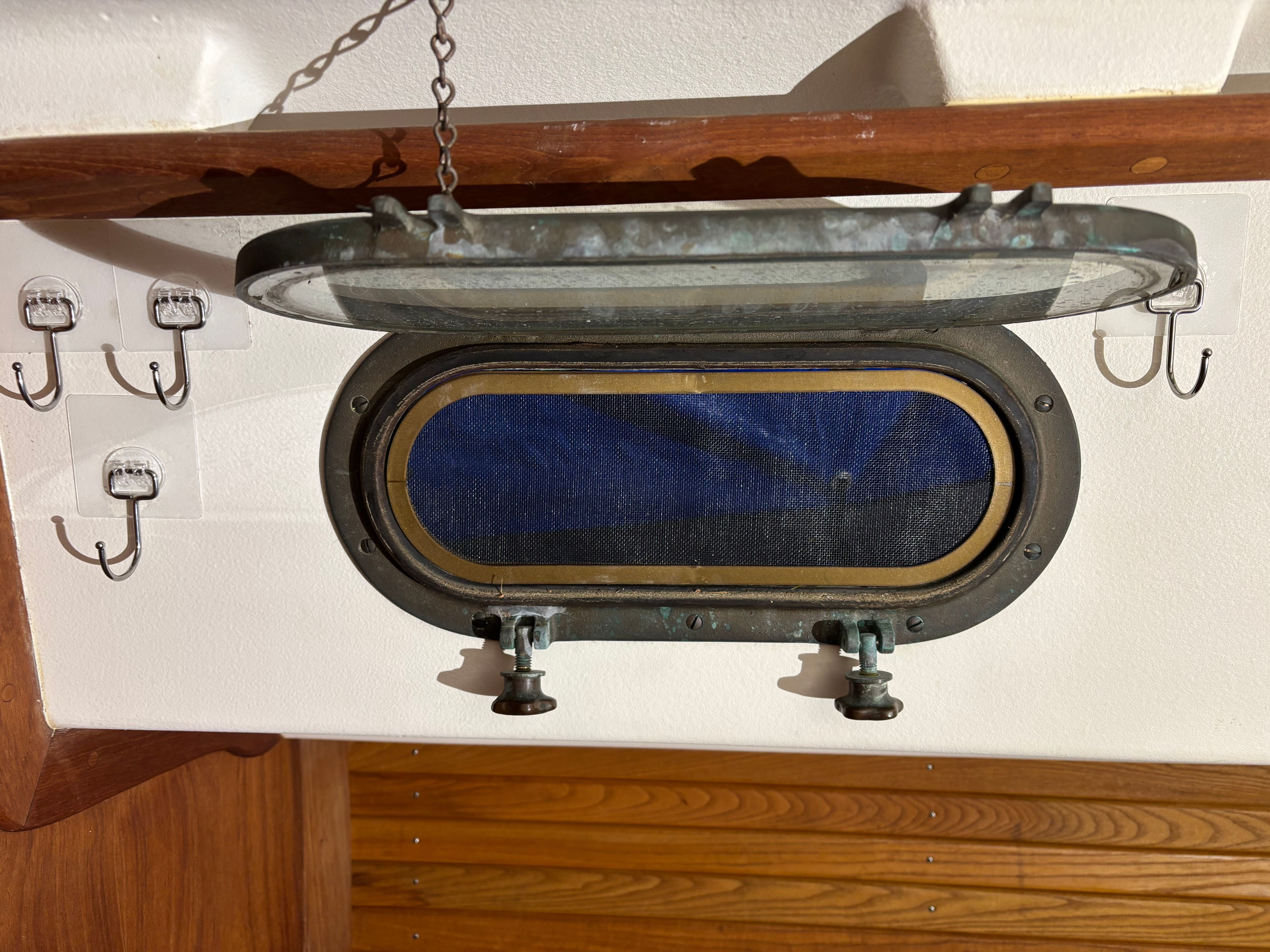 Open porthole on a 1986 Cape Dory 26 boat.