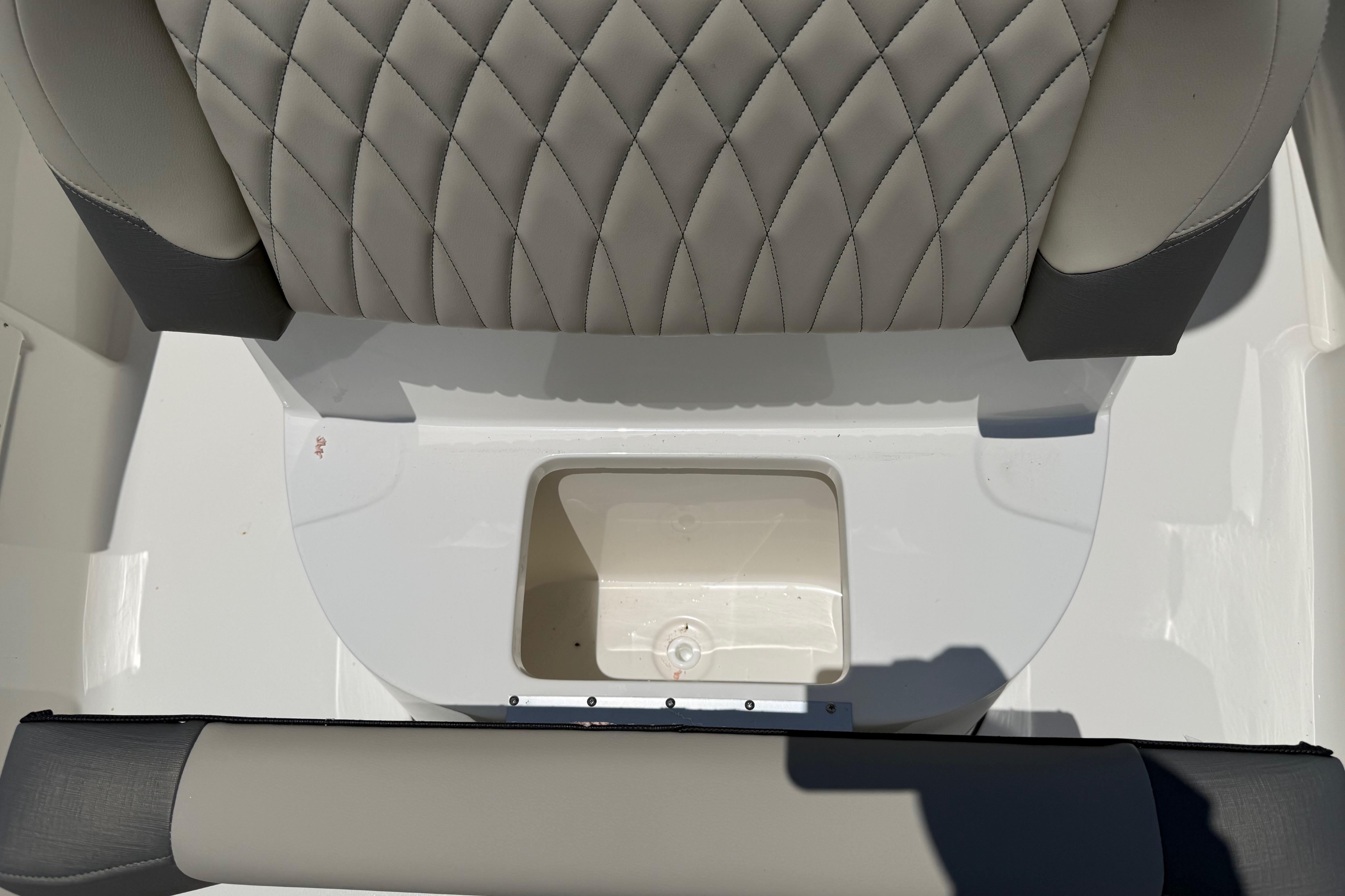2027 Key West 249 FS boat seat with diamond-pattern upholstery and storage compartment.