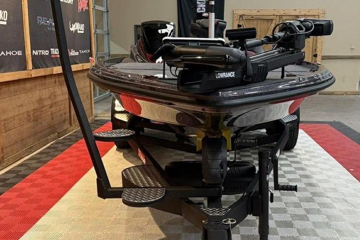 2026 Triton 20XP Patriot boat on display with advanced Lowrance equipment.
