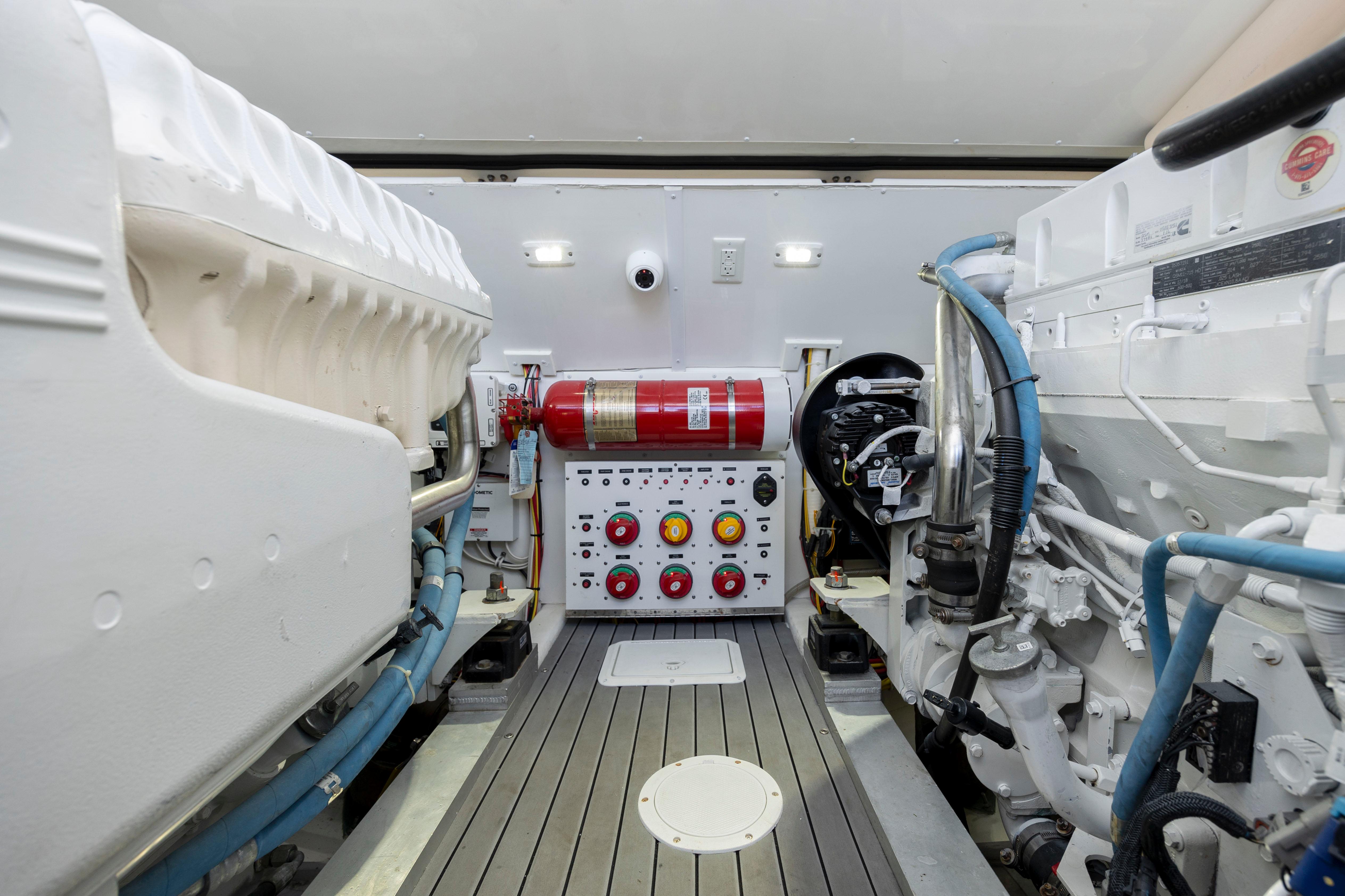 2019 Albemarle 410 Express Fisherman engine room with control panel and fire extinguisher.
