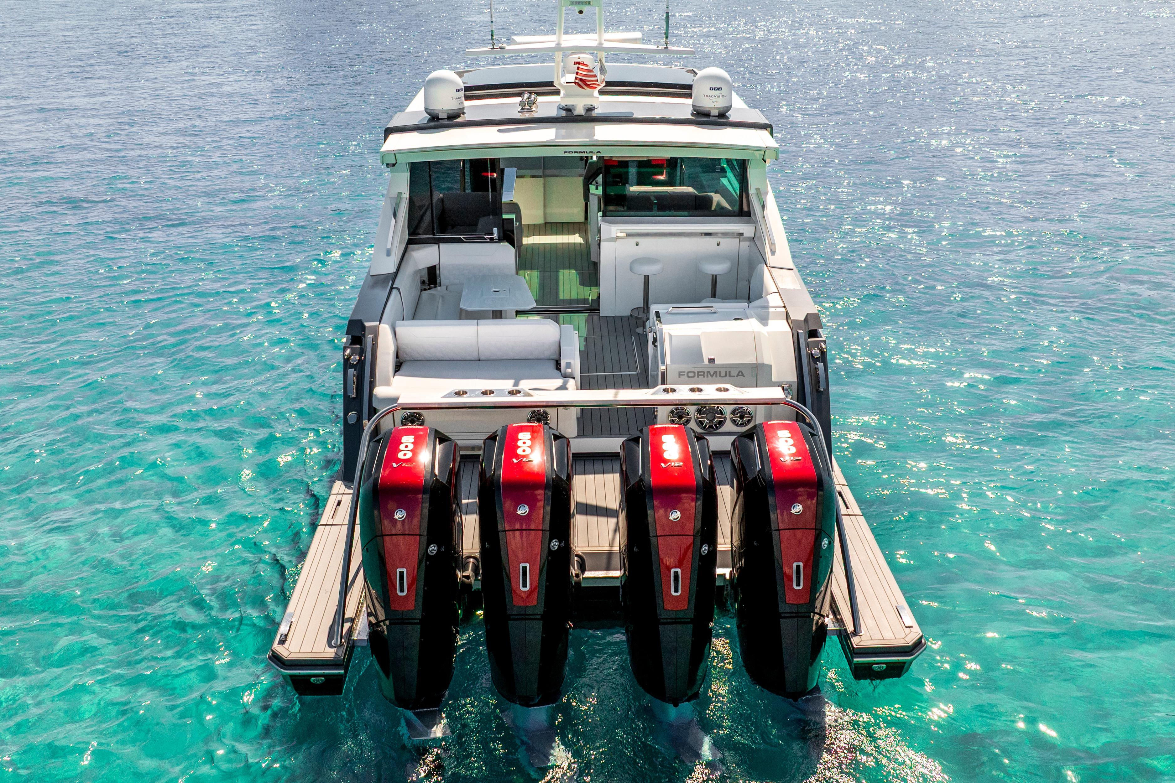 2022 Formula 500 Super Sport Crossover boat with four powerful engines on clear blue water.