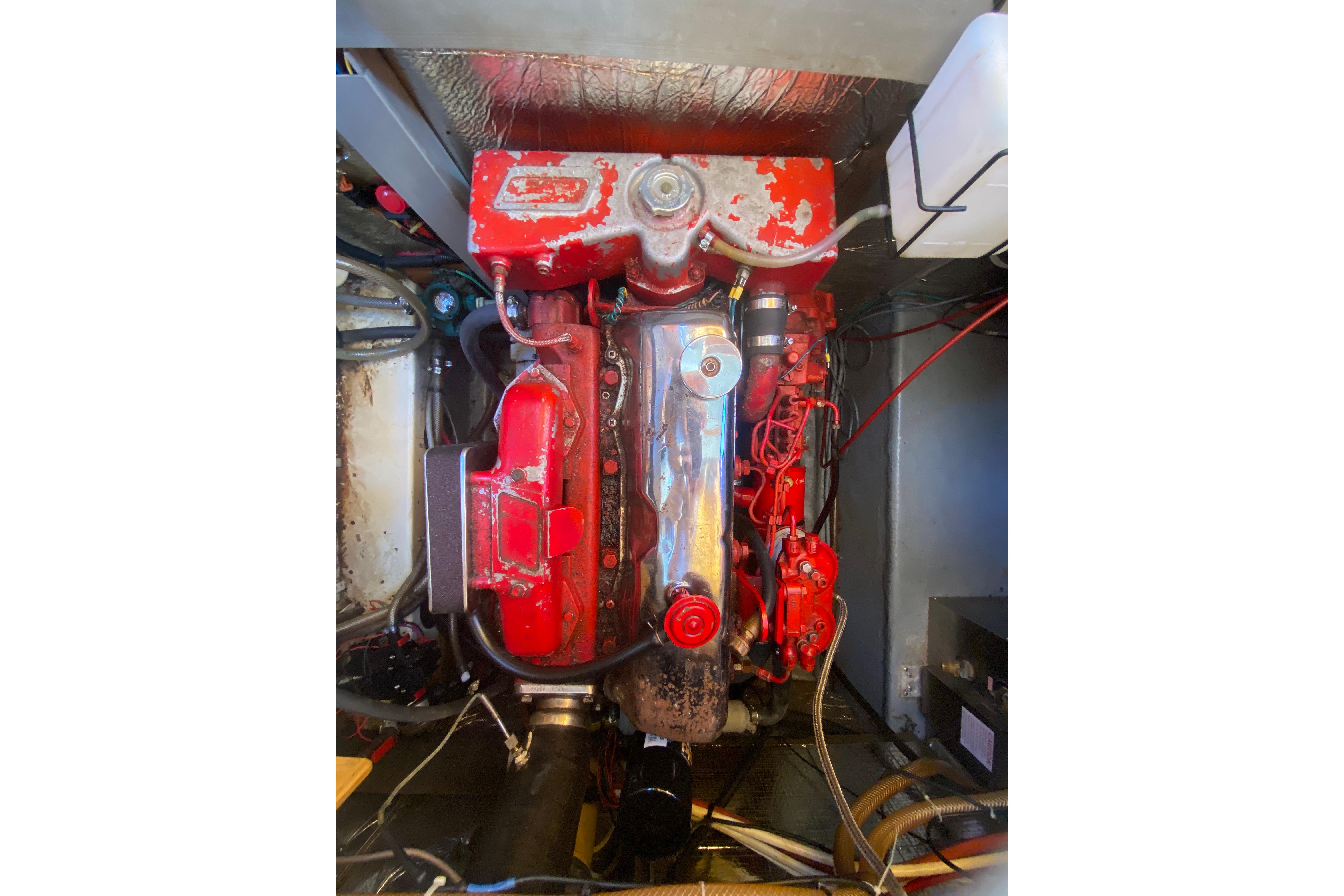 1986 Transpacific Marine Eagle engine, red and metallic components, in a boat's engine compartment.