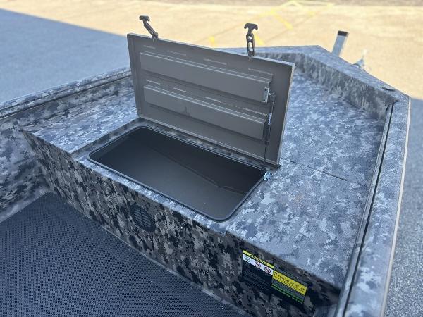 2025 Havoc 1656 VJST boat with open storage compartment, camo design.